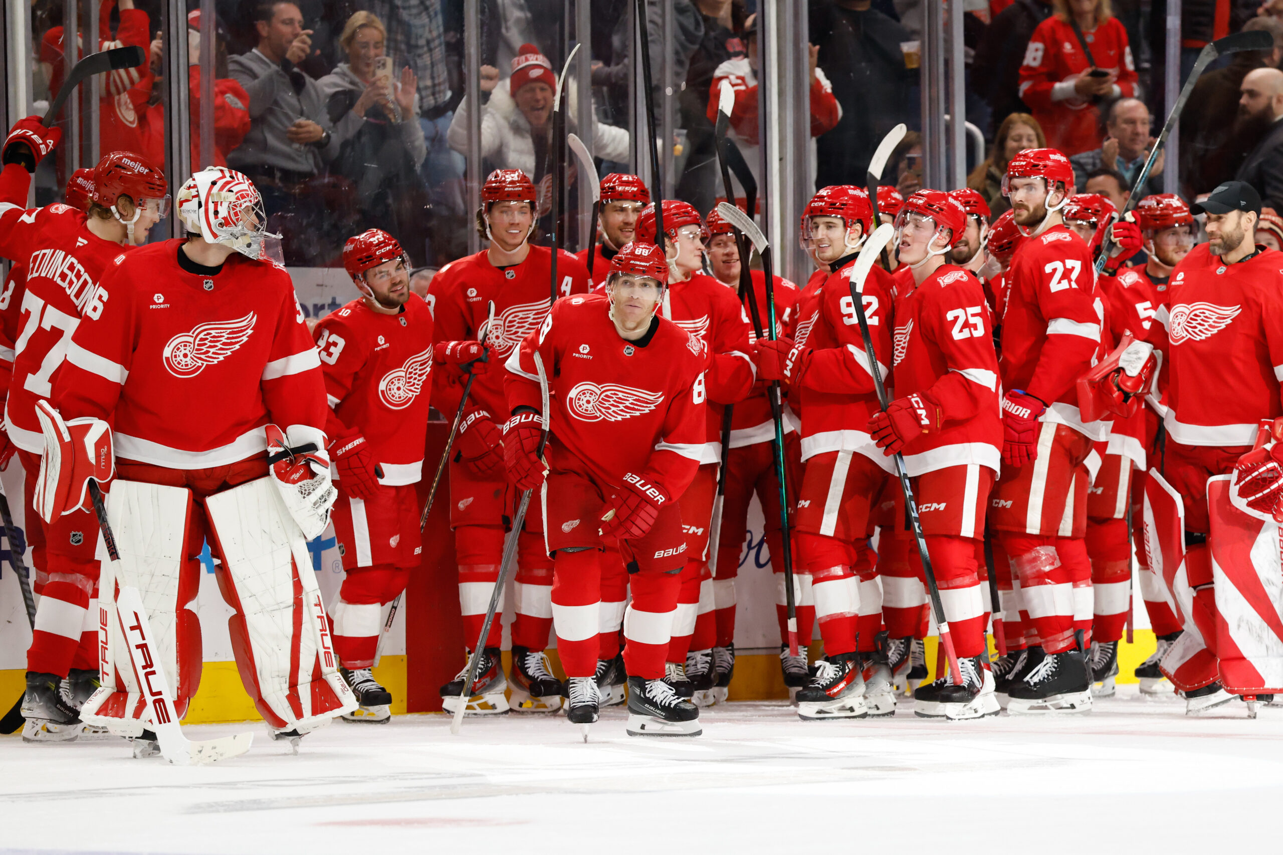 Jan 8, 2026; Detroit, Michigan, USA;  Detroit Red Wings right wing Patrick Kane (88) receives congratulations from teammates after he scores his 500 career goal in the third period against the Vancouver Canucks at Little Caesars Arena. Mandatory Credit: Rick Osentoski-Imagn Images