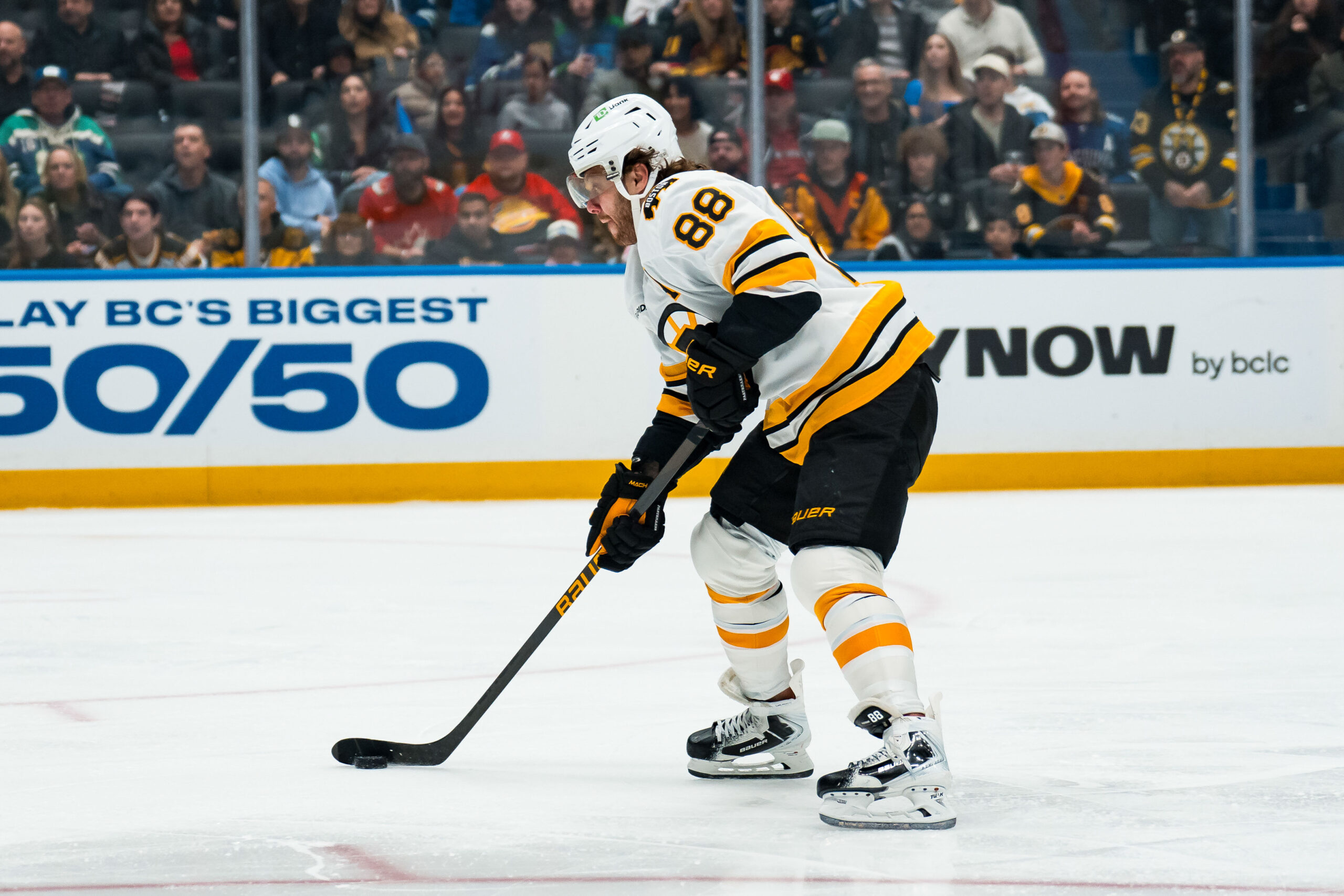 Jan 3, 2026; Vancouver, British Columbia, CAN; Boston Bruins forward David Pastrnak (88) handles the puck against the Vancouver Canucks in the first period at Rogers Arena. Mandatory Credit: Bob Frid-Imagn Images