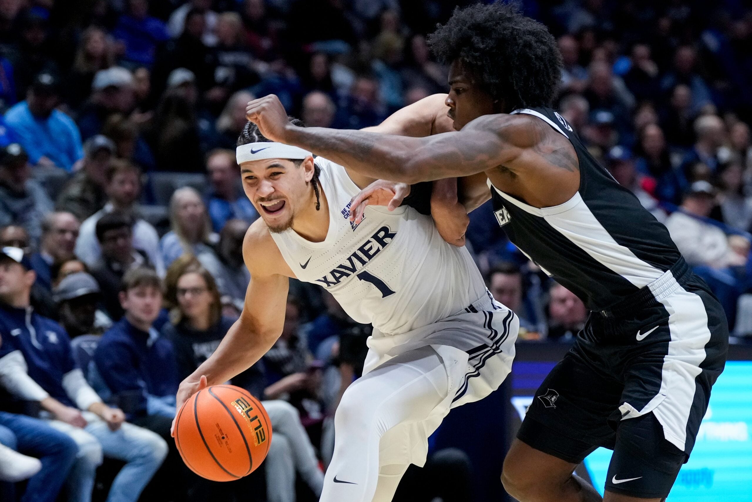 Xavier Musketeers guard Malik Messina-Moore (1) drives in the first half of the NCAA Big East Conference basketball game between the Xavier Musketeers and the Providence Friars at the Cintas Center in Cincinnati on Saturday, Jan. 10, 2026.