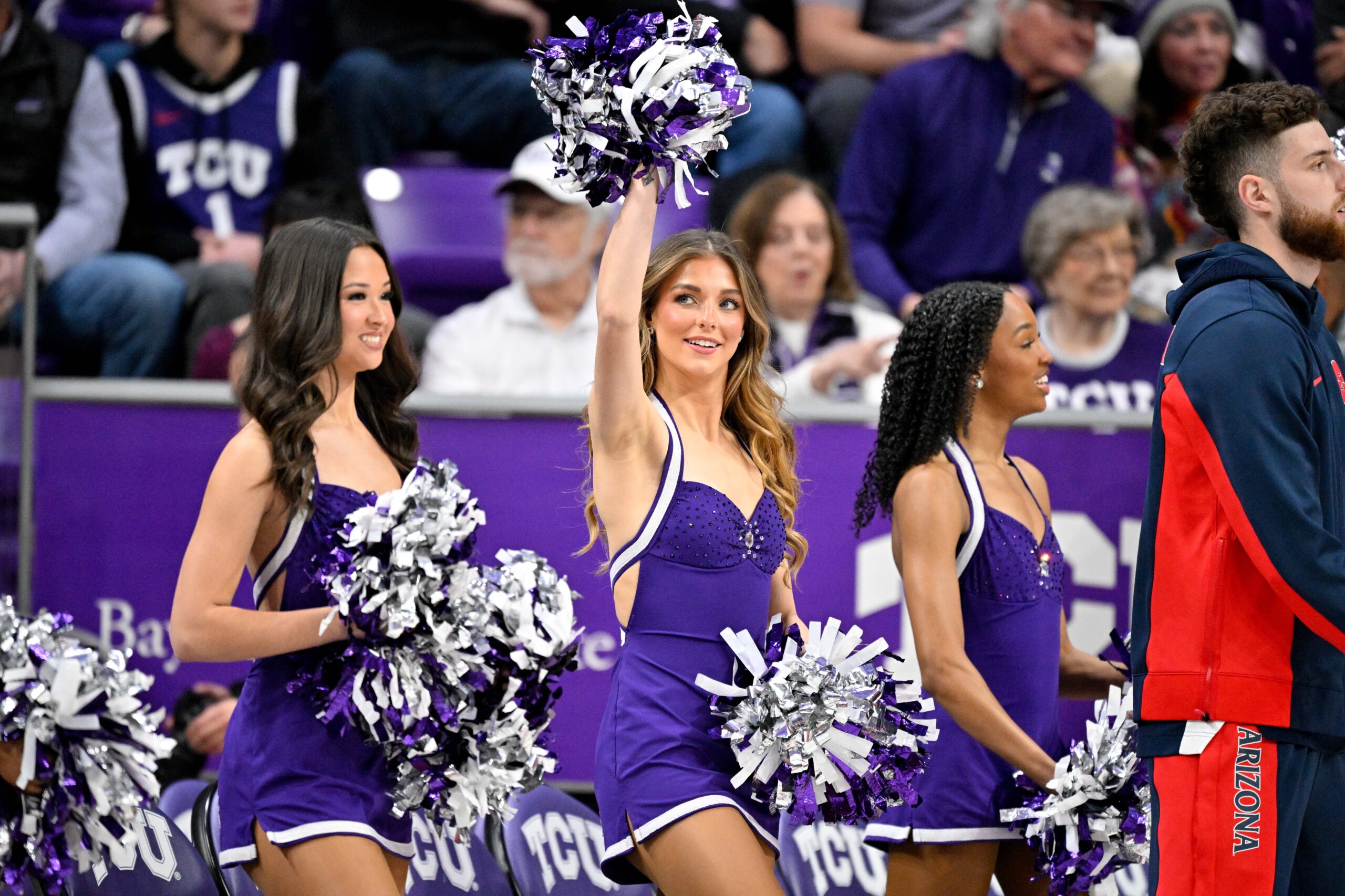 Jan 10, 2026; Fort Worth, Texas, USA; The TCU Horned Frogs cheerleader dancers wave to the crowd during the game between the TCU Horned Frogs and the Arizona Wildcats at the Ed and Rae Schollmaier Arena. Mandatory Credit: Jerome Miron-Imagn Images