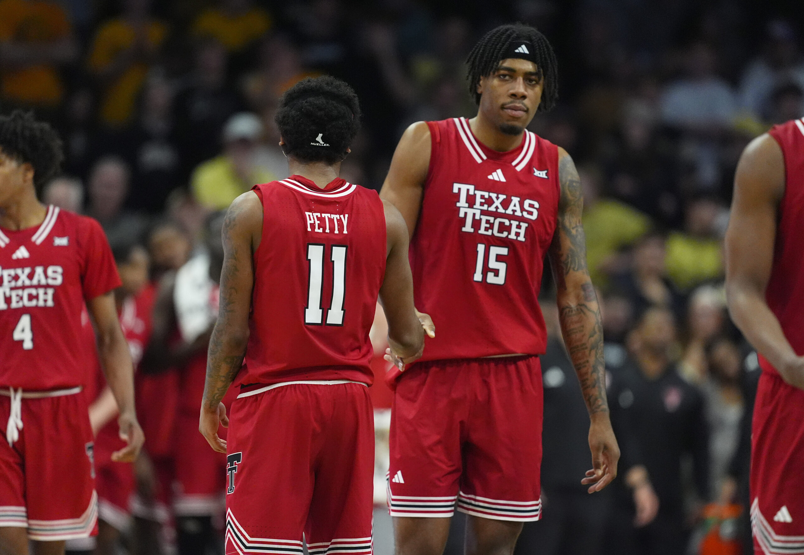 Jan 10, 2026; Boulder, Colorado, USA; Texas Tech Red Raiders guard Jaylen Petty (11) and forward JT Toppin (15) during the second half against the Colorado Buffaloes at CU Events Center. Mandatory Credit: Ron Chenoy-Imagn Images