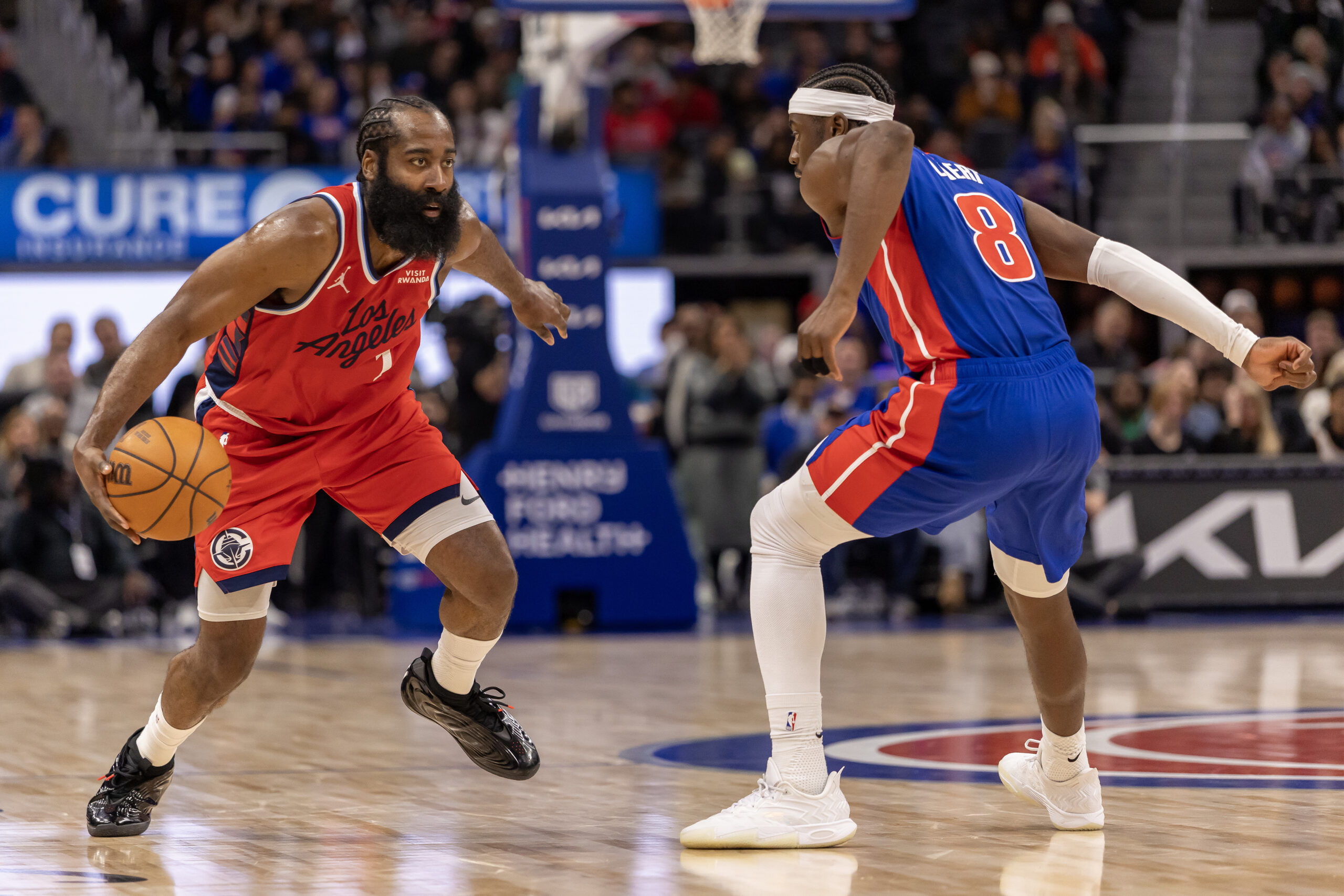 Jan 10, 2026; Detroit, Michigan, USA; Detroit Pistons guard Caris LeVert (8) defends against LA Clippers guard James Harden (1) during the second half at Little Caesars Arena. Mandatory Credit: David Reginek-Imagn Images