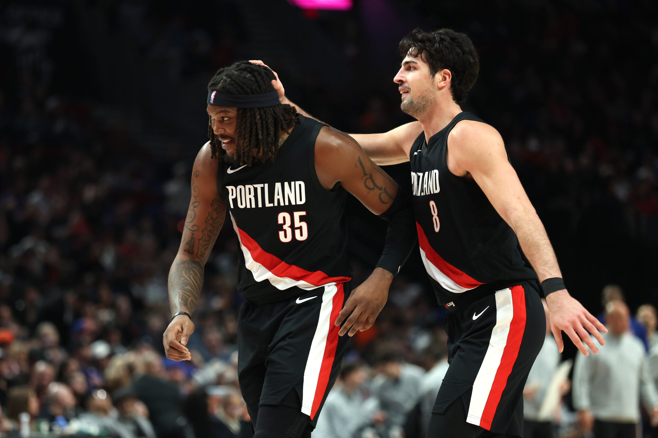 Jan 11, 2026; Portland, Oregon, USA;  Portland Trail Blazers forward Deni Avdija (8) congratulates teammate  center/forward Robert Williams III (35) for scoring against the New York Knicks during the second half at Moda Center. Mandatory Credit: Jaime Valdez-Imagn Images