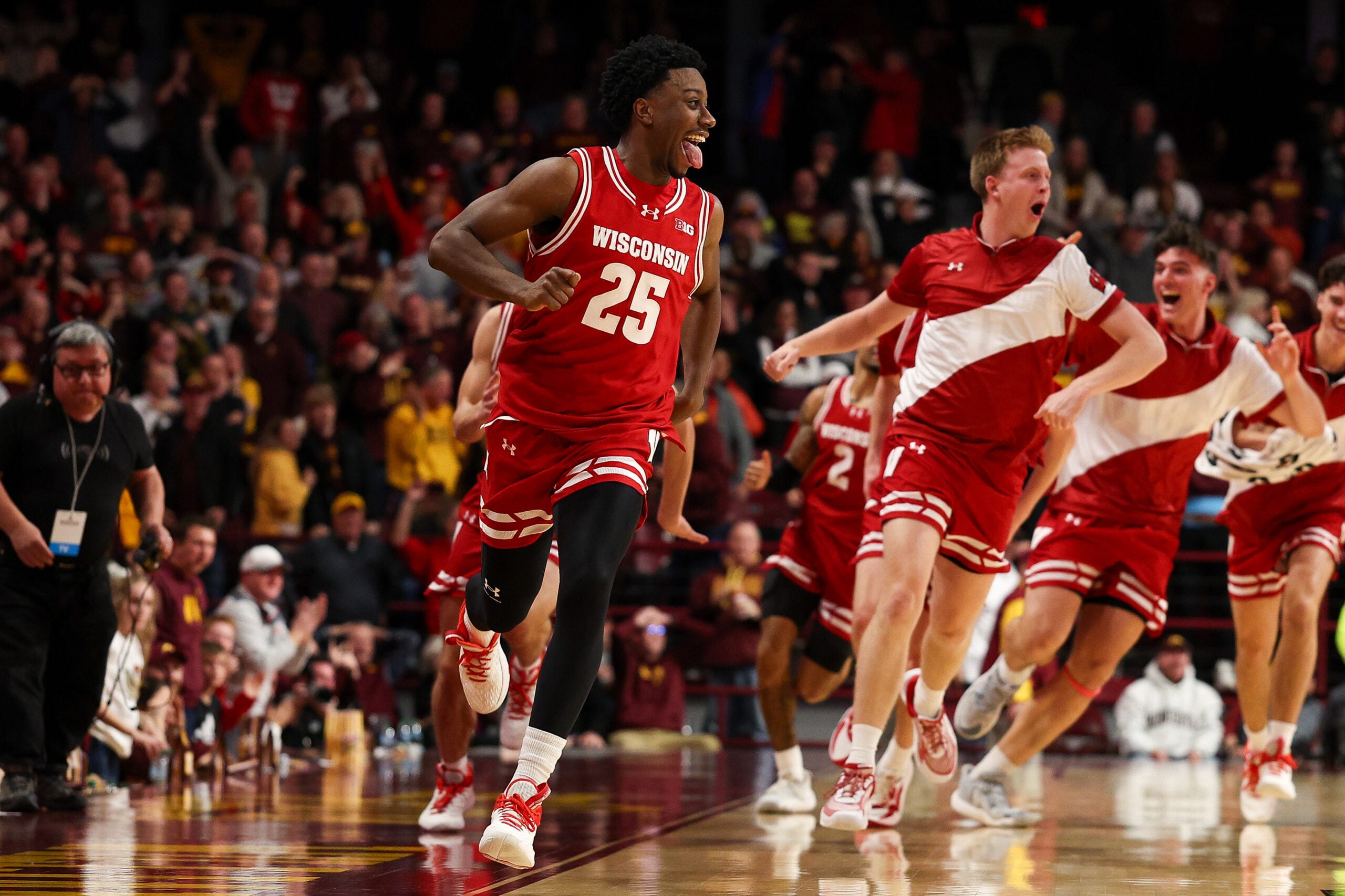 Jan 13, 2026; Minneapolis, Minnesota, USA; Wisconsin Badgers guard John Blackwell (25) celebrates his game winning three-point basket against the Minnesota Golden Gophers during the second half at Williams Arena. Mandatory Credit: Matt Krohn-Imagn Images