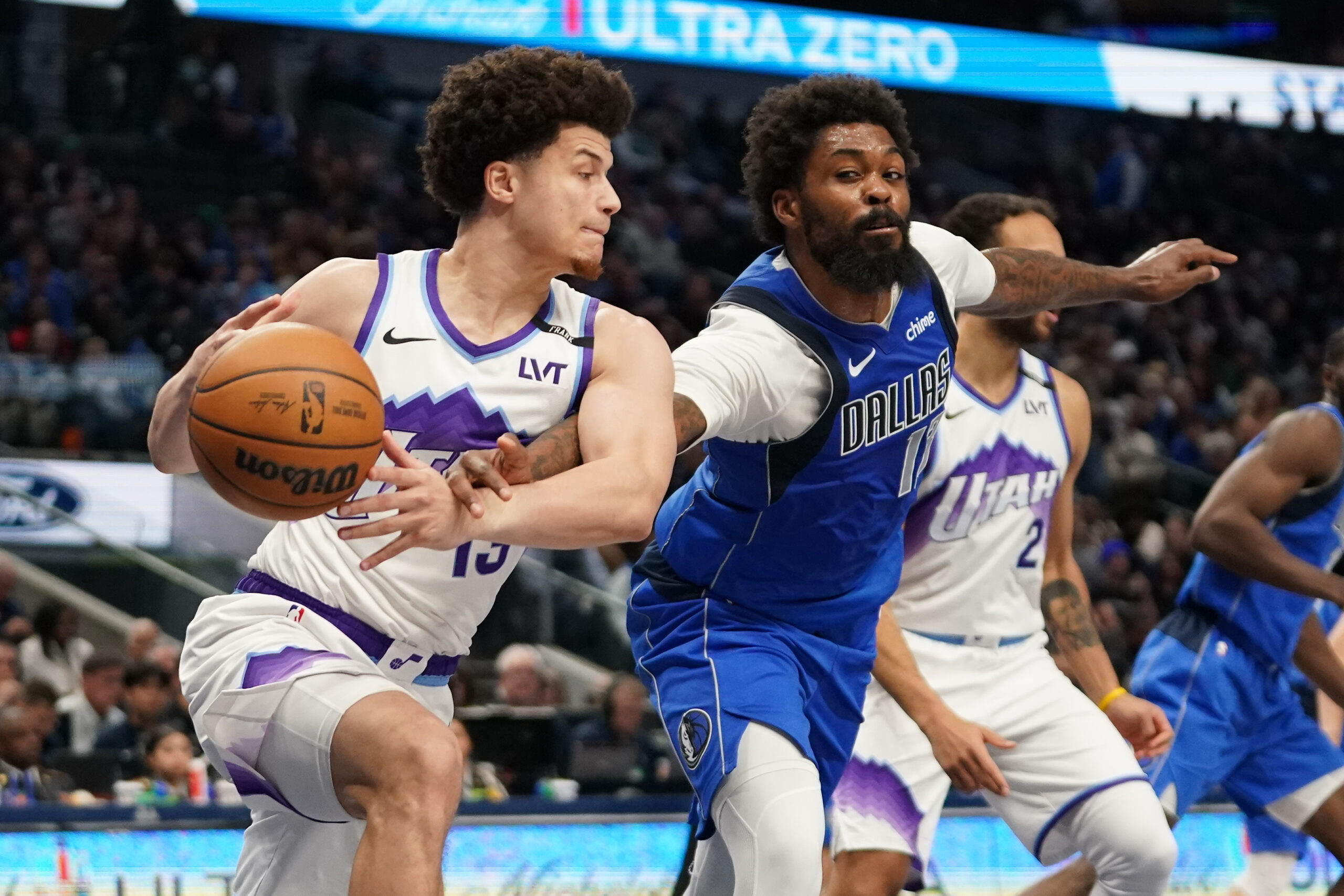 Jan 15, 2026; Dallas, Texas, USA;  Dallas Mavericks forward Naji Marshall (13) makes the steal on Utah Jazz guard Walter Clayton Jr. (13) during the second half at American Airlines Center. Mandatory Credit: Raymond Carlin III-Imagn Images