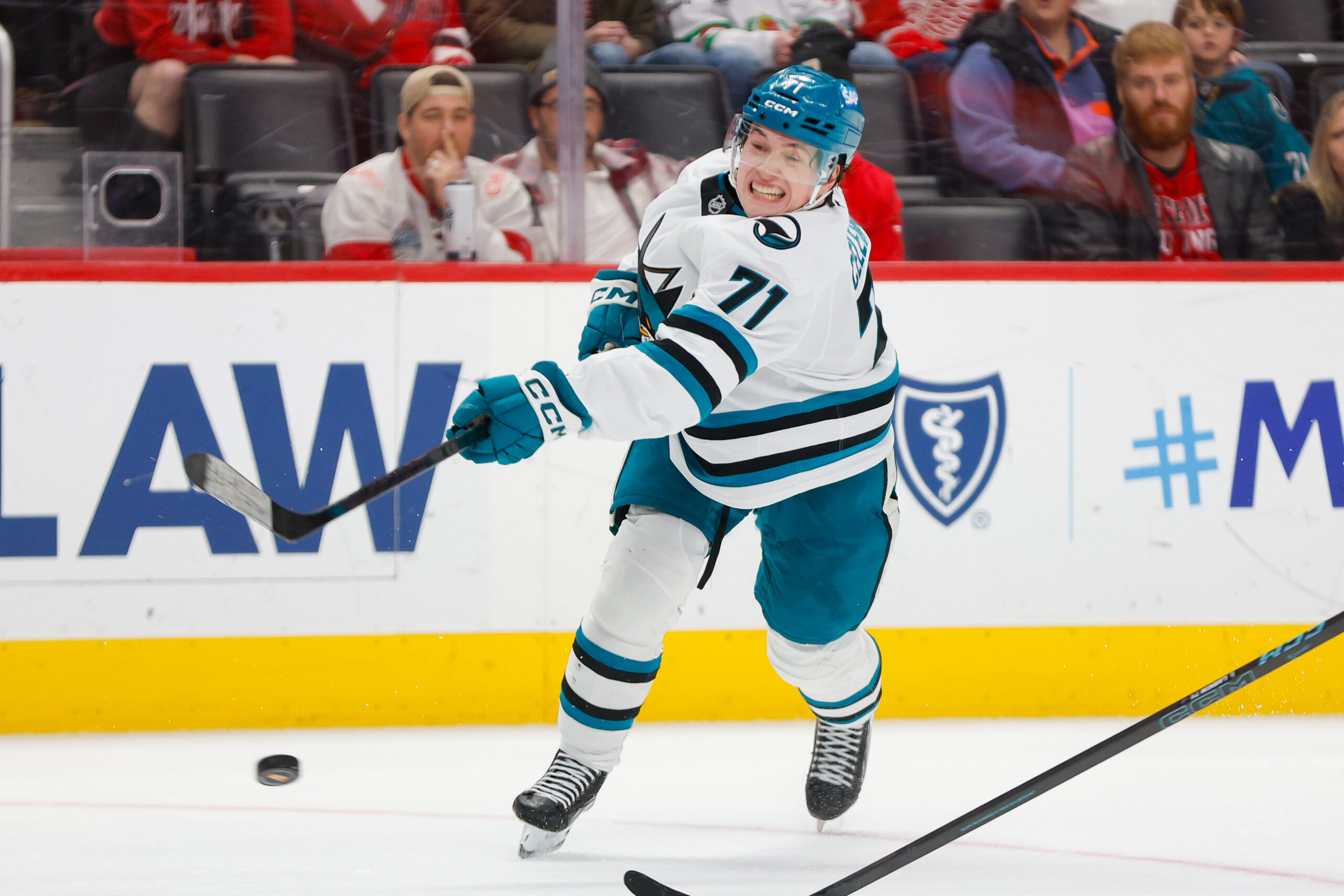 Jan 16, 2026; Detroit, Michigan, USA; San Jose Sharks center MacKlin Celebrini (71) shoots the puck during the third period at Little Caesars Arena. Mandatory Credit: Brian Bradshaw Sevald-Imagn Images