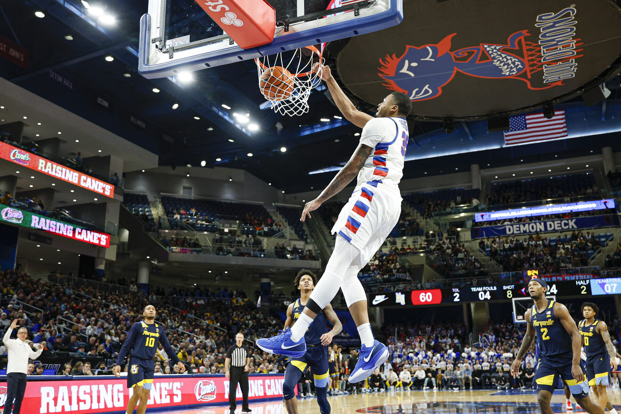 Jan 16, 2026; Chicago, Illinois, USA; DePaul Blue Demons forward N.J. Benson (35) scores against Marquette Golden Eagles during the second half at Wintrust Arena. Mandatory Credit: Kamil Krzaczynski-Imagn Images