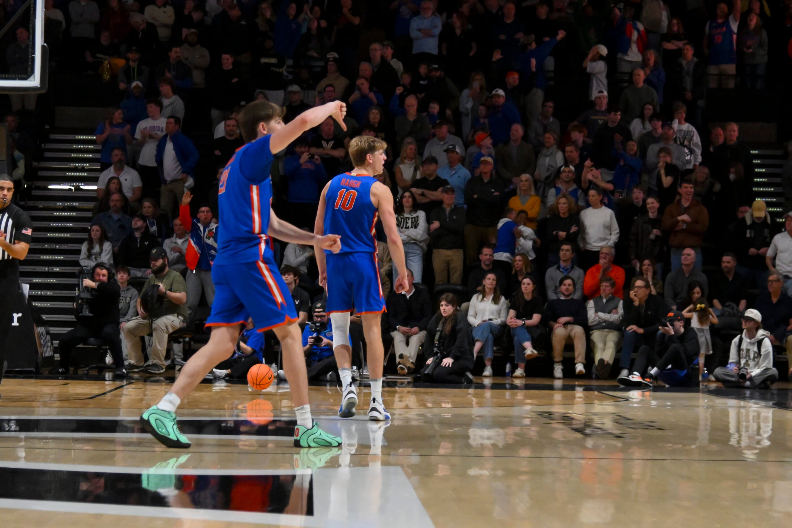 Jan 17, 2026; Nashville, Tennessee, USA;  Florida Gators forward Alex Condon (21) and forward Thomas Haugh (10) taunt the Vanderbilt Commodores student section during the second half at Memorial Gymnasium. Mandatory Credit: Steve Roberts-Imagn Images