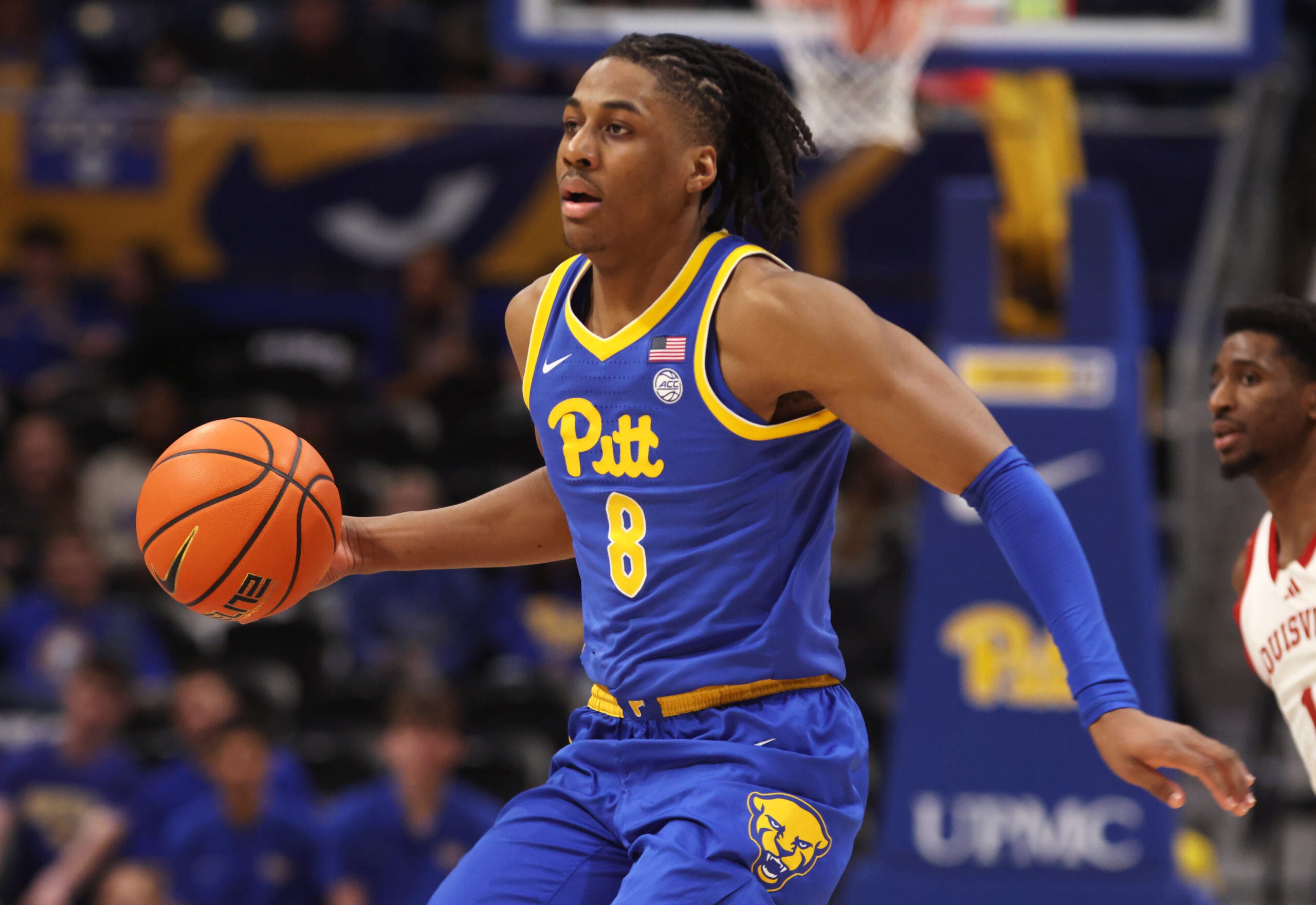 Jan 17, 2026; Pittsburgh, Pennsylvania, USA; Pittsburgh Panthers guard Omari Witherspoon (8) dribbles the ball against the Louisville Cardinals during the second half at the Petersen Events Center. Mandatory Credit: Charles LeClaire-Imagn Images