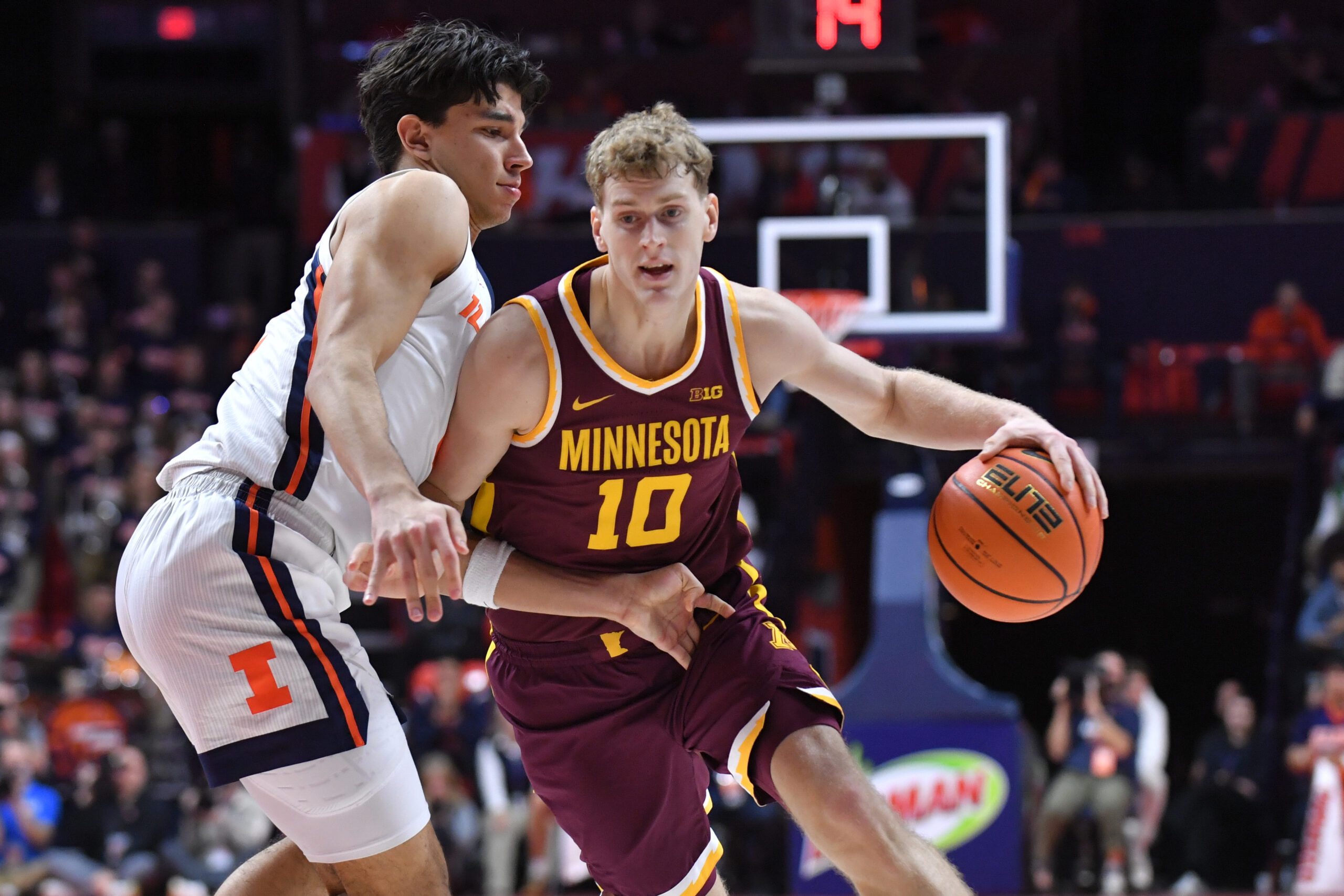 Jan 17, 2026; Champaign, Illinois, USA;  Minnesota Golden Gophers guard Cade Tyson (10) drives the ball as Illinois Fighting Illini guard Andrej Stojakovic (2) defends during the second half at State Farm Center. Mandatory Credit: Ron Johnson-Imagn Images