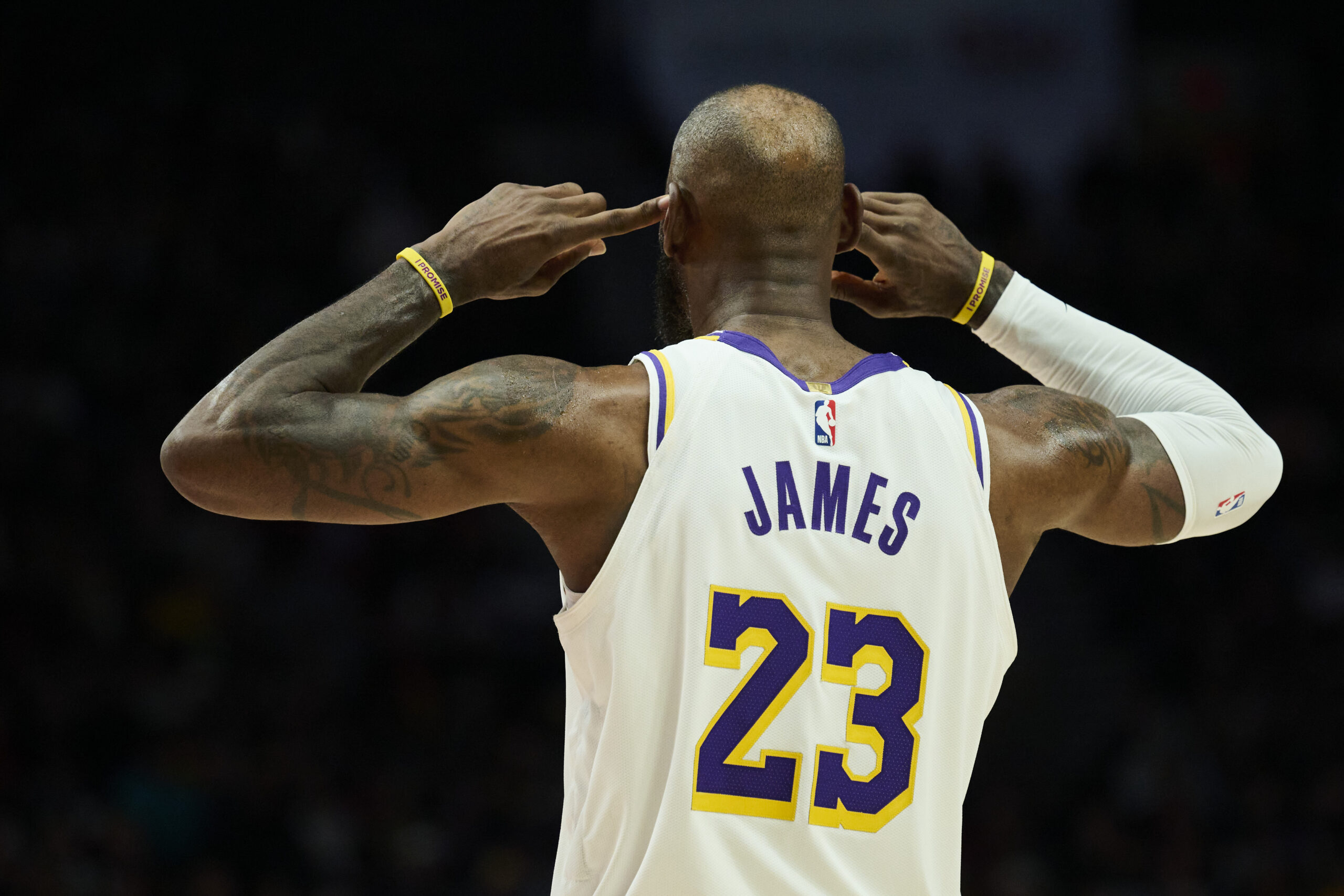 Jan 17, 2026; Portland, Oregon, USA; Los Angeles Lakers forward LeBron James (23) cups his ears as he looks to the coach for a play call during the second half against the Portland Trail Blazers at Moda Center. Mandatory Credit: Troy Wayrynen-Imagn Images