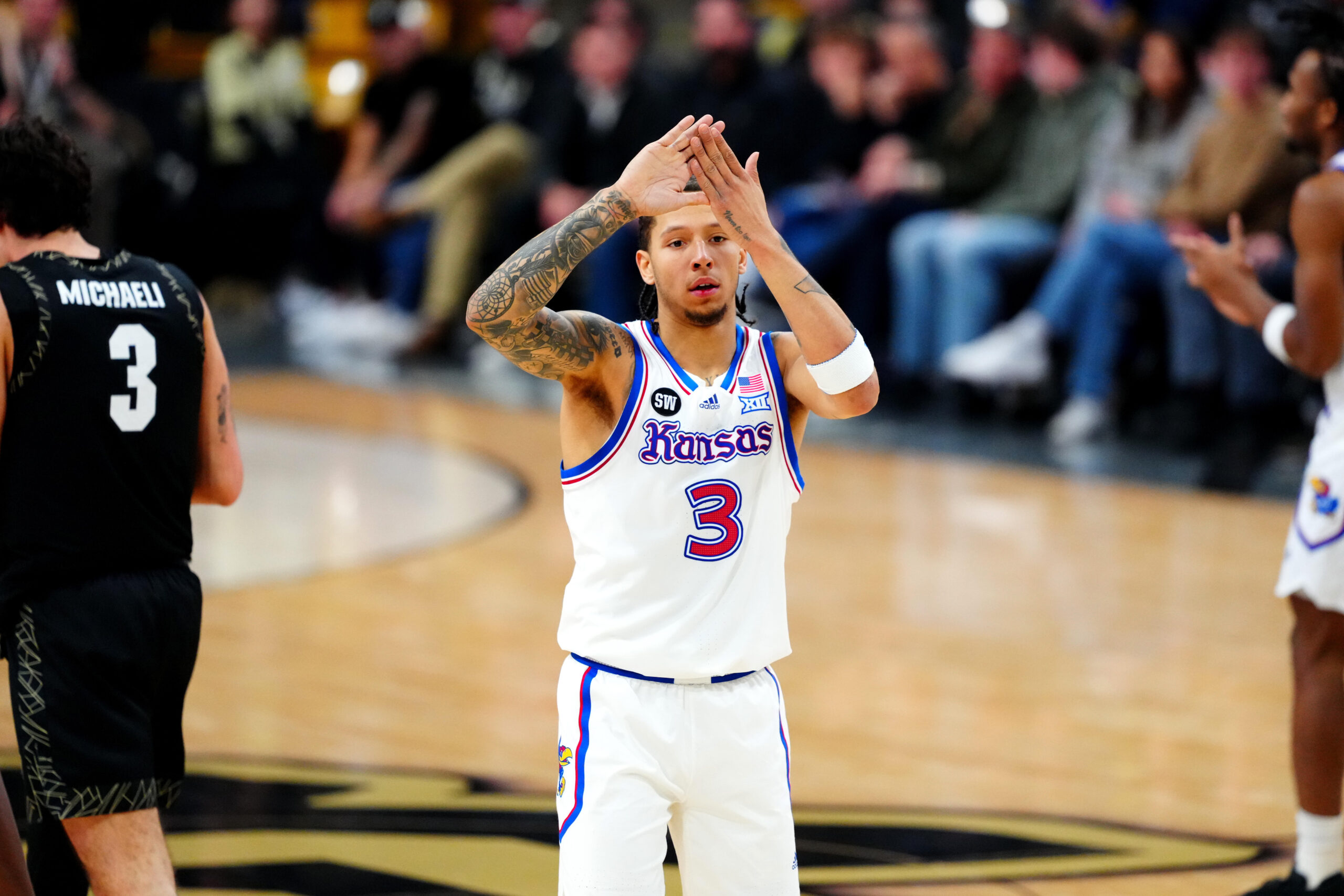Jan 20, 2026; Boulder, Colorado, USA; Kansas Jayhawks guard Tre White (3) reacts after his three point basket in the first half against the Colorado Buffaloes at the CU Events Center. Mandatory Credit: Ron Chenoy-Imagn Images