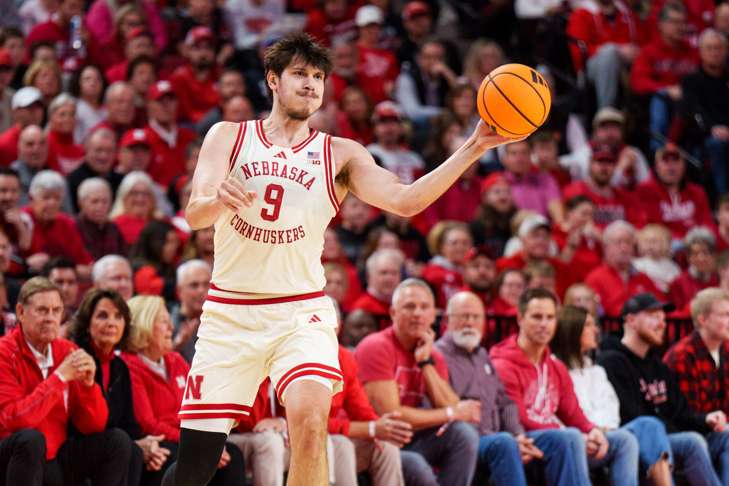 Jan 21, 2026; Lincoln, Nebraska, USA; Nebraska Cornhuskers forward Berke Buyuktuncel (9) passes against the Washington Huskies during the first half at Pinnacle Bank Arena. Mandatory Credit: Dylan Widger-Imagn Images