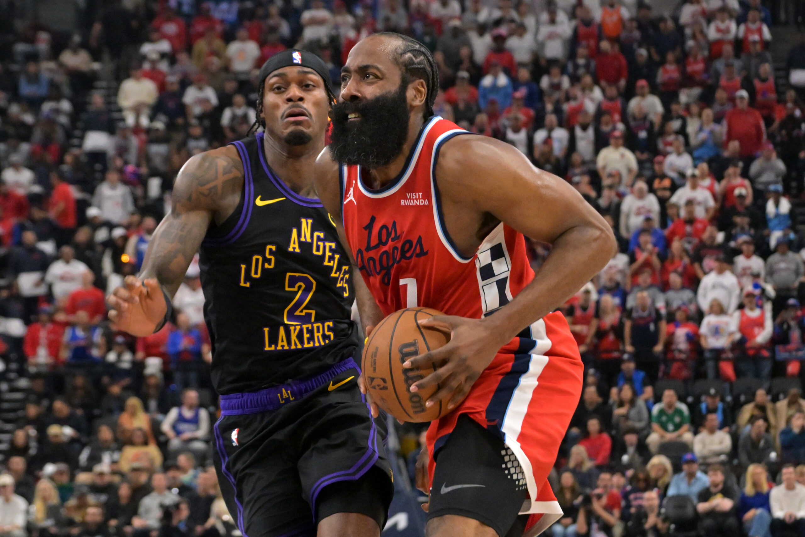 Jan 22, 2026; Inglewood, California, USA;  Los Angeles Clippers guard James Harden (1) drives past Los Angeles Lakers forward Jarred Vanderbilt (2) in the first half at Intuit Dome. Mandatory Credit: Jayne Kamin-Oncea-Imagn Images