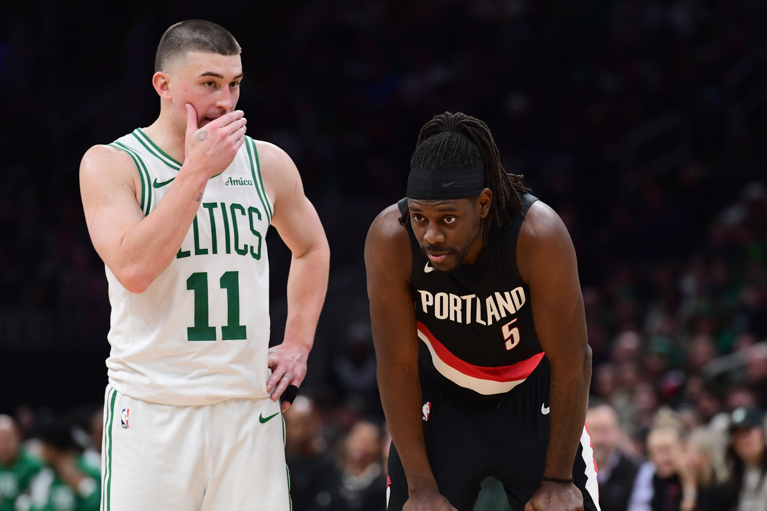 Jan 26, 2026; Boston, Massachusetts, USA; Boston Celtics guard Payton Pritchard (11) talks with Portland Trail Blazers guard Jrue Holiday (5) during the second half at TD Garden. Mandatory Credit: Bob DeChiara-Imagn Images