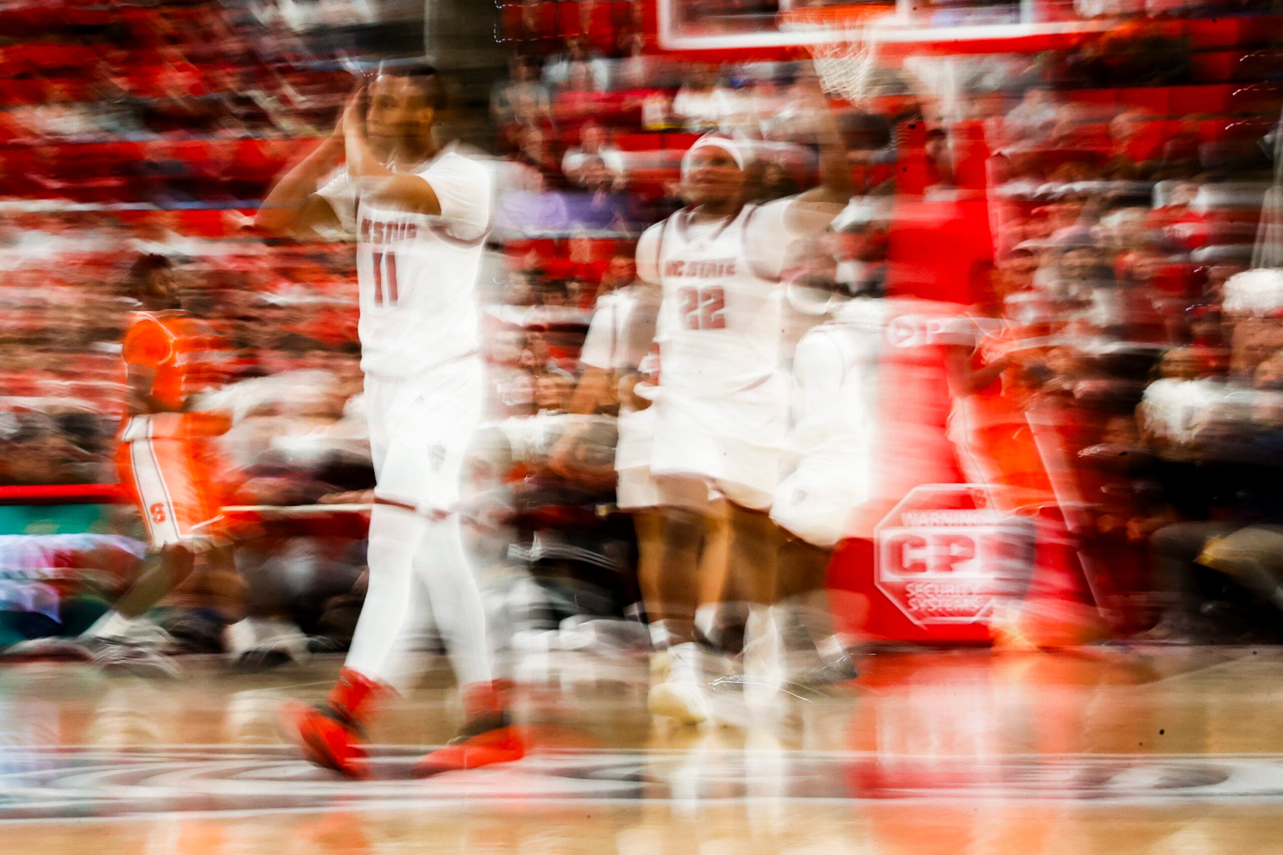 Jan 27, 2026; Raleigh, North Carolina, USA; NC State Wolfpack guard Quadir Copeland (11) and forward Ven-Allen Lubin (22) reacts to a win during the second half of the game against the Syracuse Orange at Lenovo Center. Mandatory Credit: Jaylynn Nash-Imagn Images