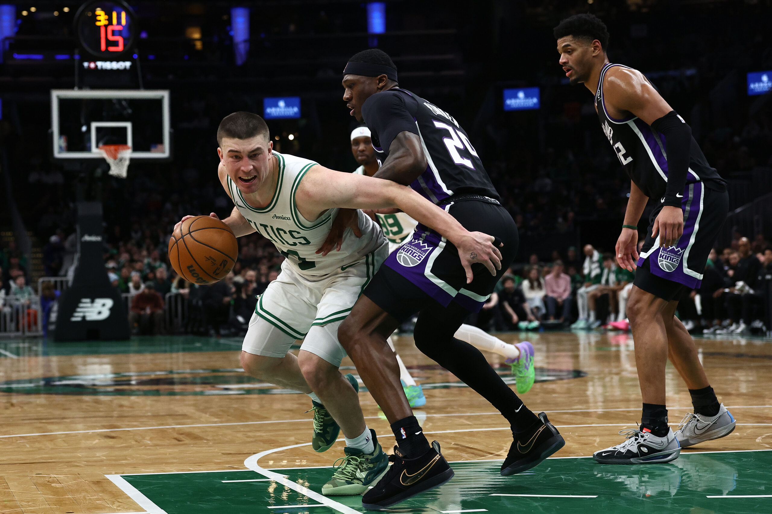 Jan 30, 2026; Boston, Massachusetts, USA; Boston Celtics guard Payton Pritchard (11) looks for a way around Sacramento Kings guard Daeqwon Plowden (29) during the second half at TD Garden. Mandatory Credit: Winslow Townson-Imagn Images