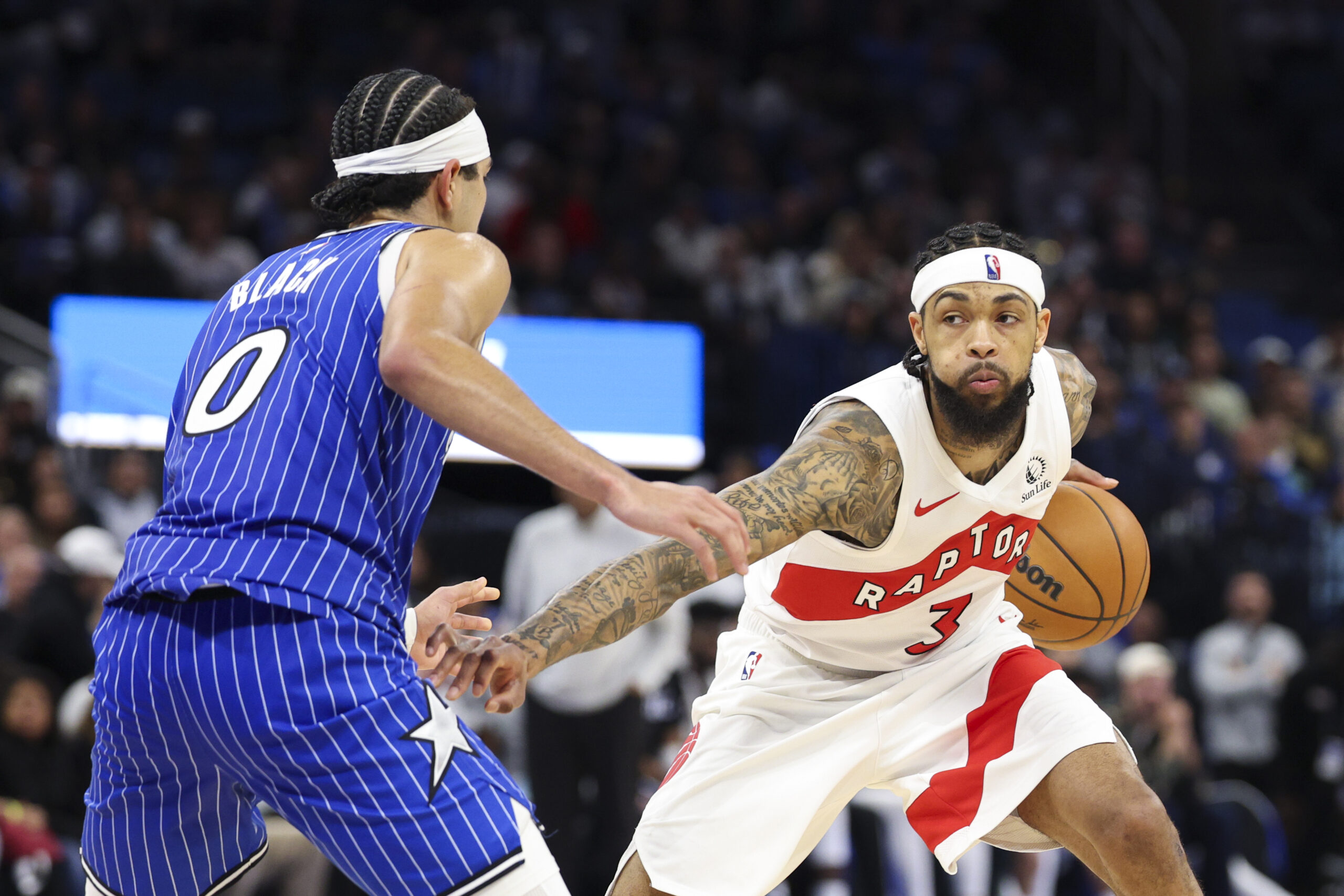 Jan 30, 2026; Orlando, Florida, USA; Toronto Raptors forward Brandon Ingram (3) is guarded by Orlando Magic guard Anthony Black (0) in the fourth quarter at Kia Center. Mandatory Credit: Nathan Ray Seebeck-Imagn Images