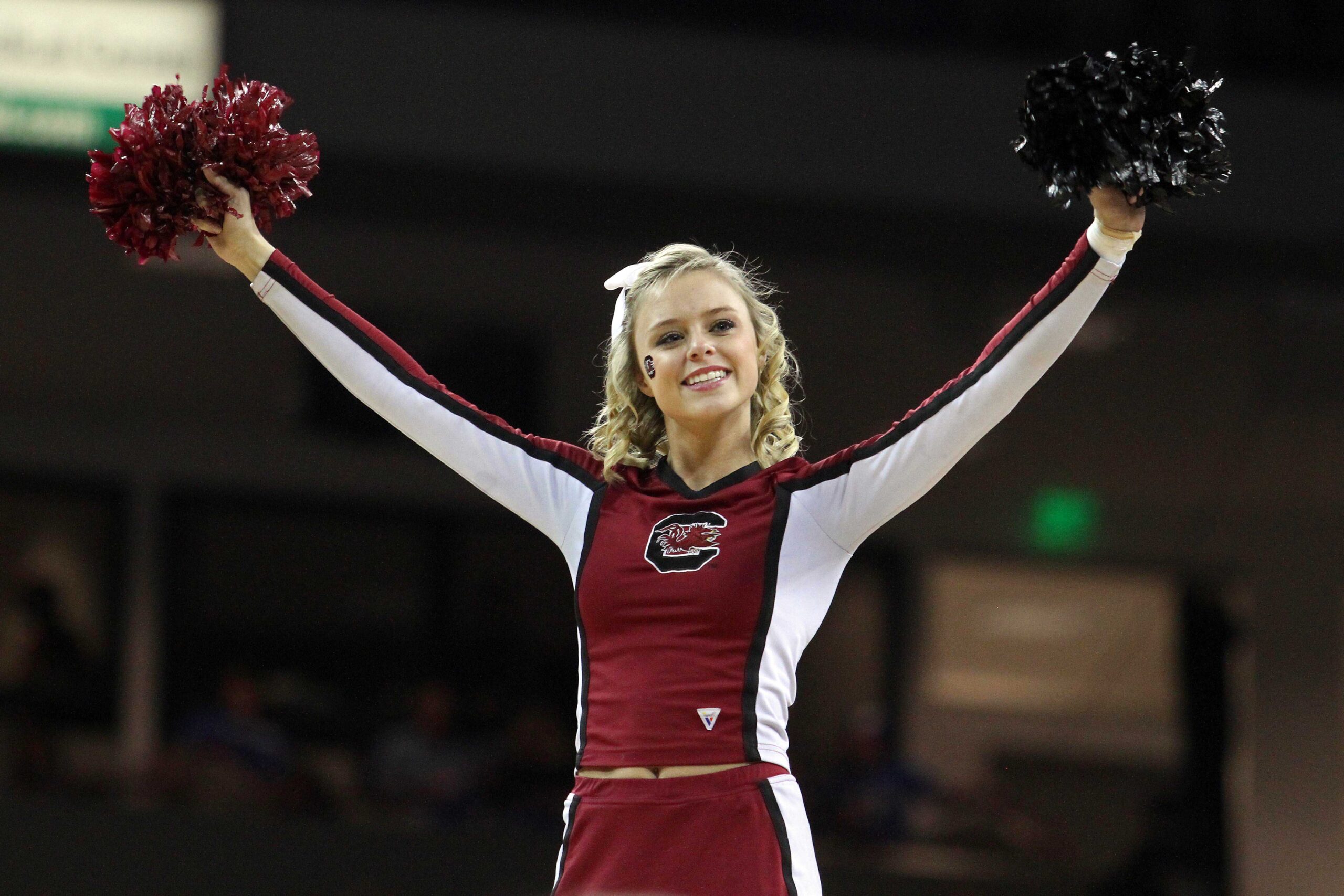 Feb 4, 2012; Columbia, SC, USA; A South Carolina Gamecocks cheerleader cheers during a tv timeout during the second half against the Kentucky Wildcats. The Kentucky Wildcats defeated the South Carolina Gamecocks 86-52 at Colonial Life Arena.  Mandatory Credit: Jeremy Brevard-Imagn Images