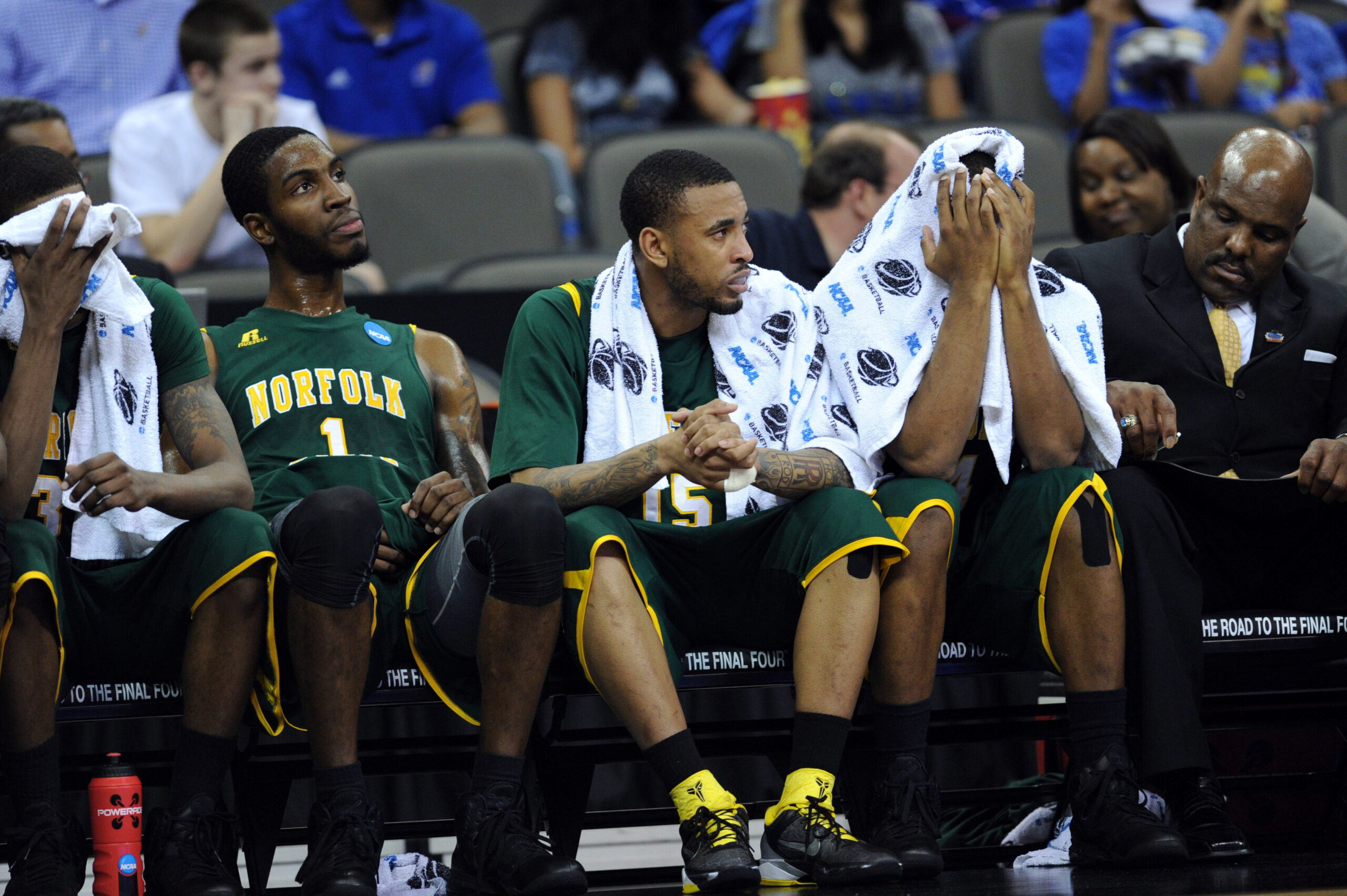 Mar 18, 2012; Omaha, NE, USA; Norfolk State Spartans players Brandon Wheeless (right) Rodney McCauley (center) and Rob Johnson (left) reacts after losing to the Florida Gators in the third round of the 2012 NCAA men's basketball tournament at the CenturyLink Center.  Florida defeated Norfolk State 84-50.  Mandatory Credit: Peter G. Aiken-Imagn Images
