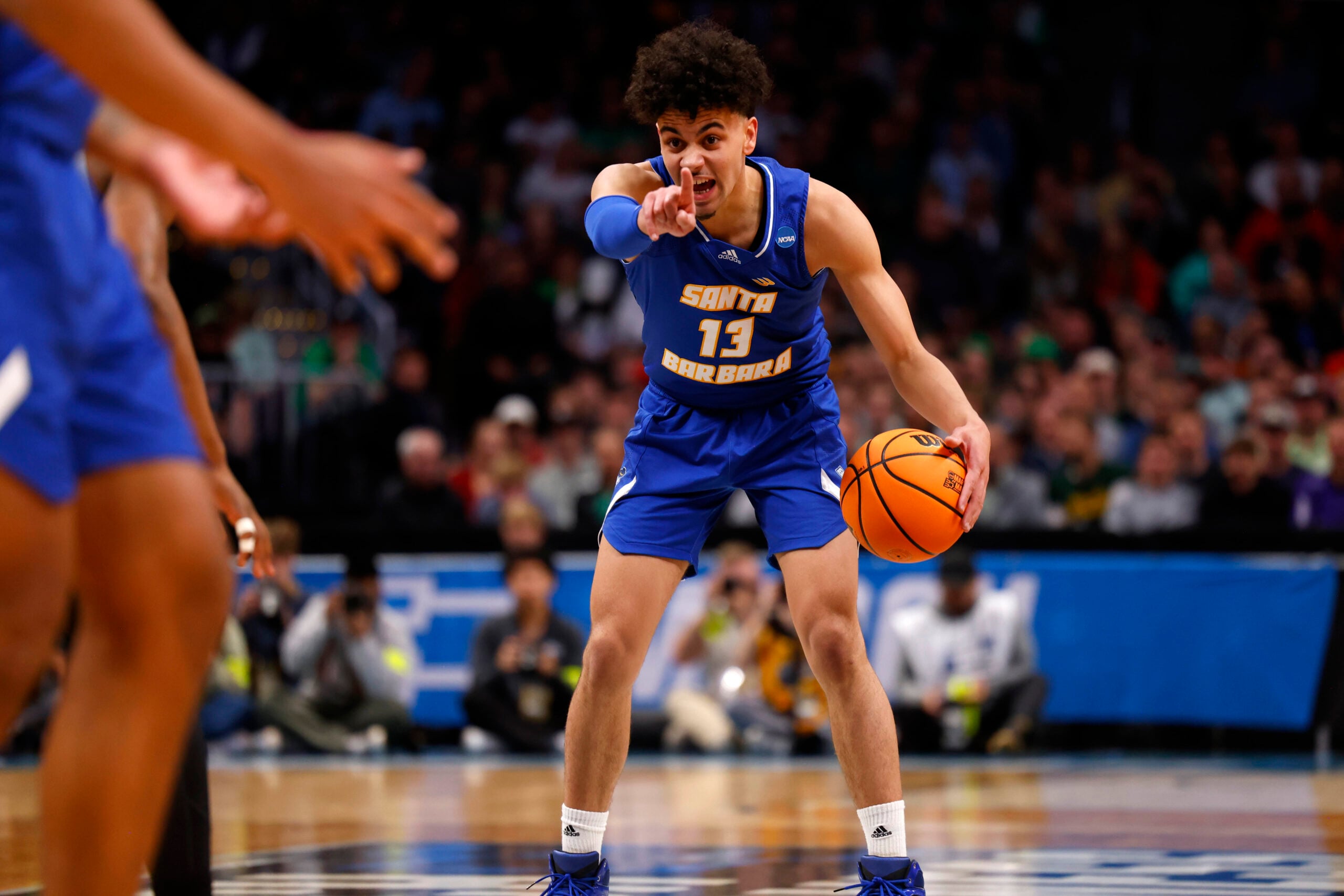 Mar 17, 2023; Denver, CO, USA;  UC Santa Barbara Gauchos guard Ajay Mitchell (13) signals to teammates during the first half against Baylor Bears in the first round of the 2023 NCAA men   s basketball tournament at Ball Arena. Mandatory Credit: Michael Ciaglo-Imagn Images