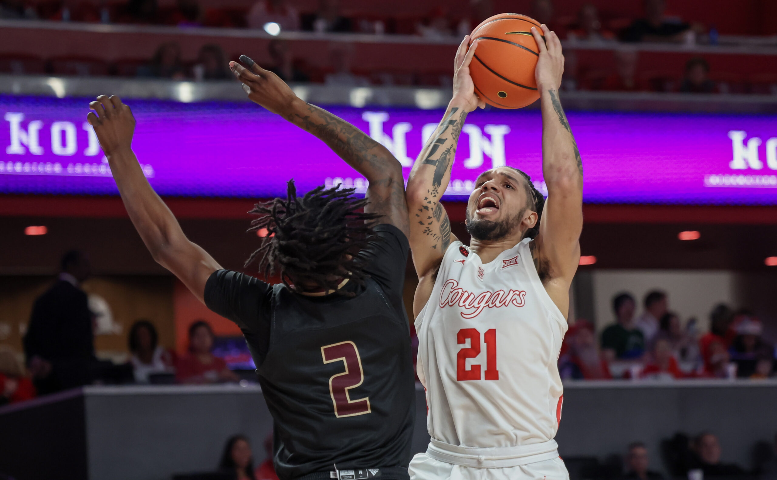 Dec 21, 2023; Houston, Texas, USA; Houston Cougars guard Emanuel Sharp (21) drives to the basket against Texas State Bobcats guard Dontae Horne (2) in the second half at Fertitta Center. Mandatory Credit: Thomas Shea-Imagn Images