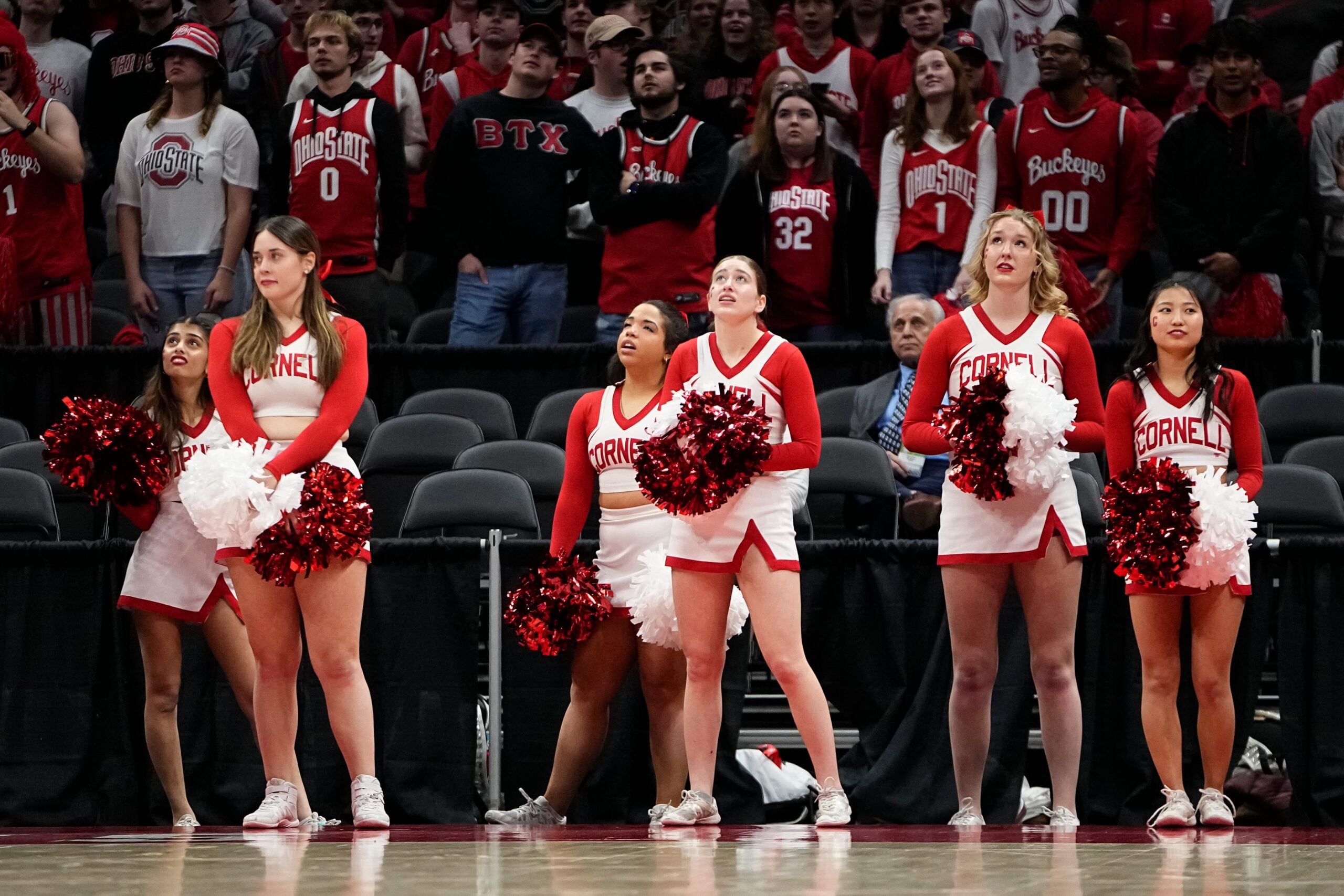 Mar 19, 2024; Columbus, OH, USA; Cornell Big Red cheerleaders react during the second half of the NIT basketball game against the Ohio State Buckeyes at Value City Arena. Ohio State won 88-83.
