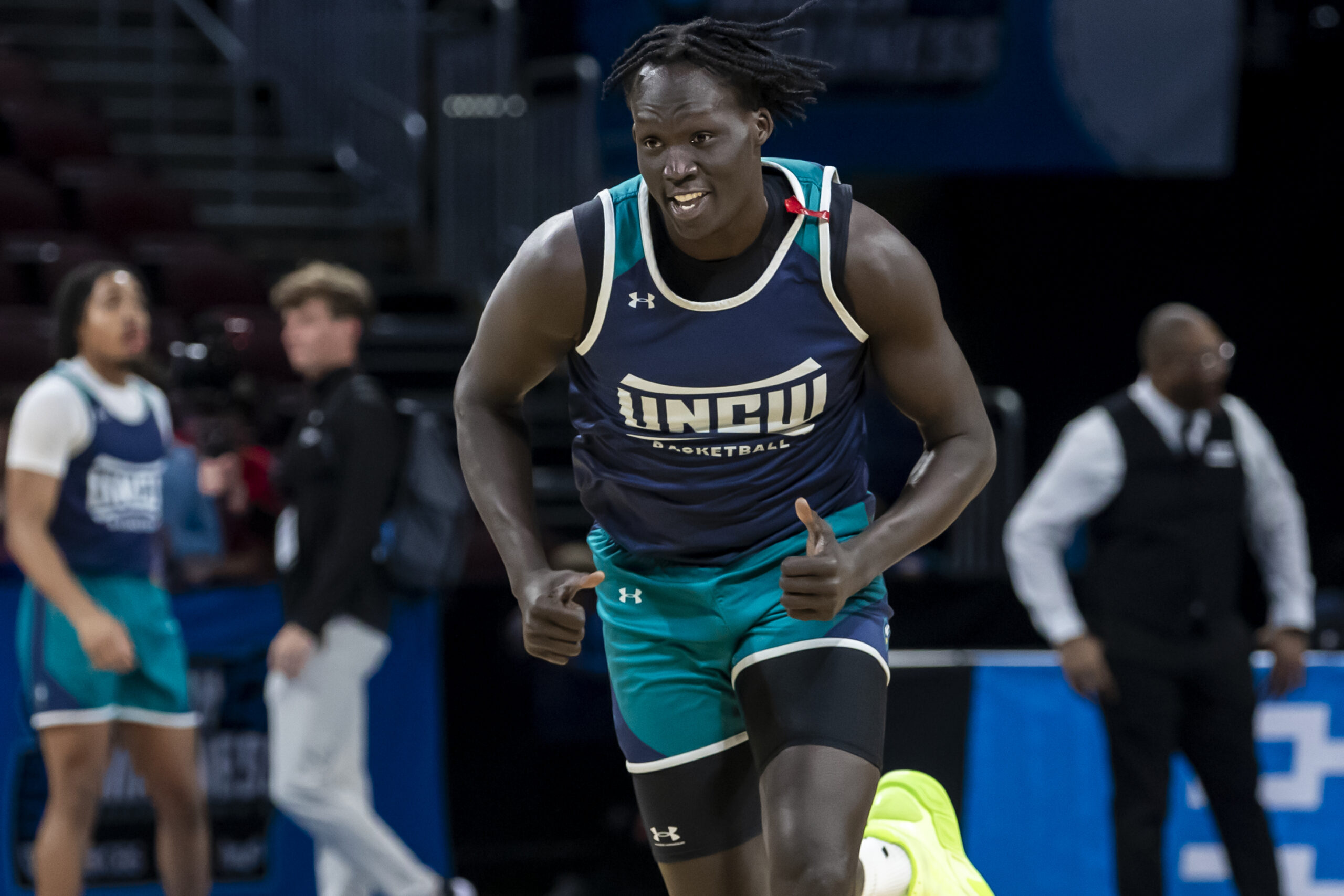 Mar 19, 2025; Wichita, KS, USA;  UNC-Wilmington Seahawks forward Makoi Mabor (13) jogs up the court during a practice session at Intrust Bank Arena. Mandatory Credit: Nick Tre. Smith-Imagn Images