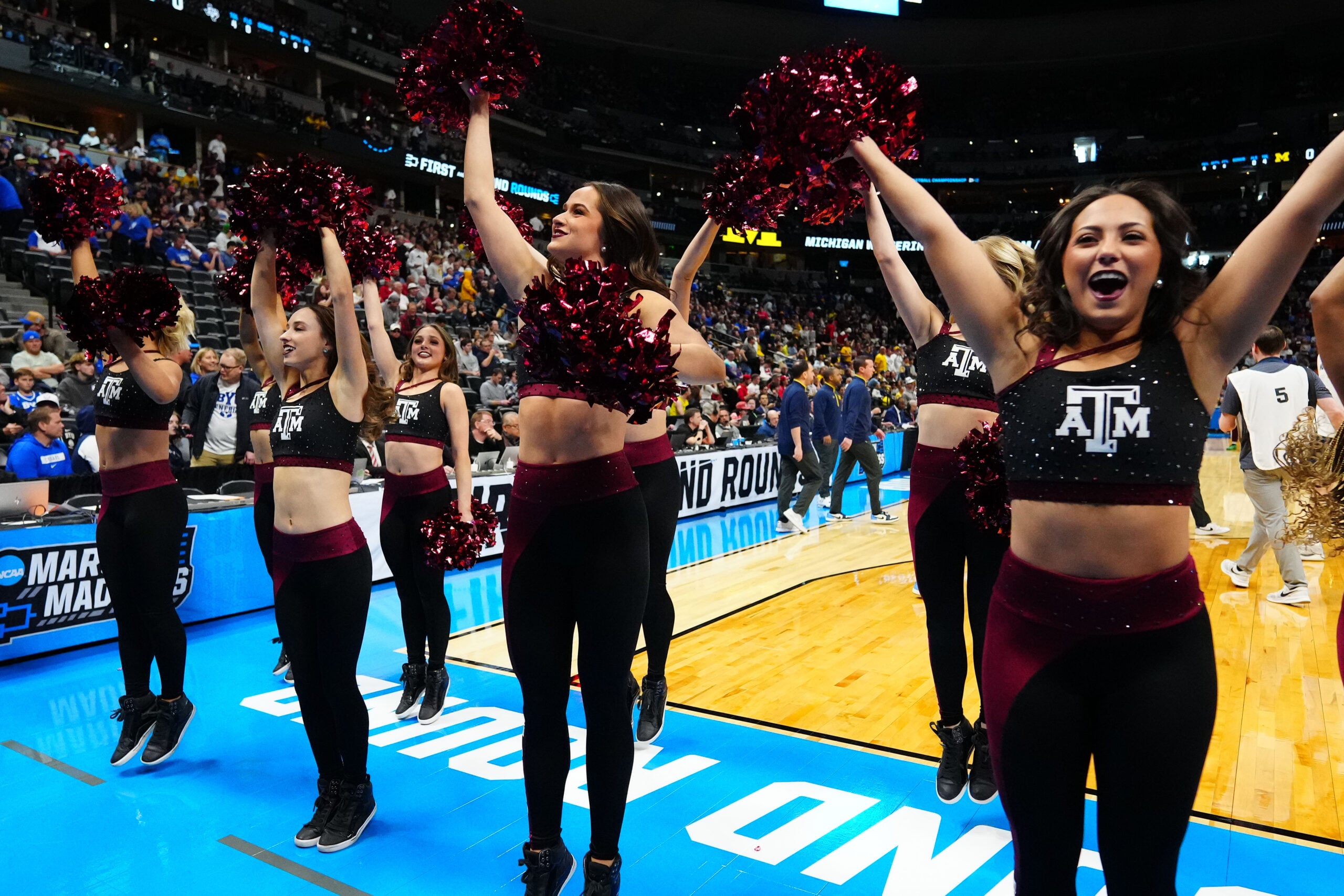 Mar 22, 2025; Denver, CO, USA; Texas A&M Aggies cheerleaders perform during the first half in the second round of the NCAA Tournament  at Ball Arena. Mandatory Credit: Ron Chenoy-Imagn Images