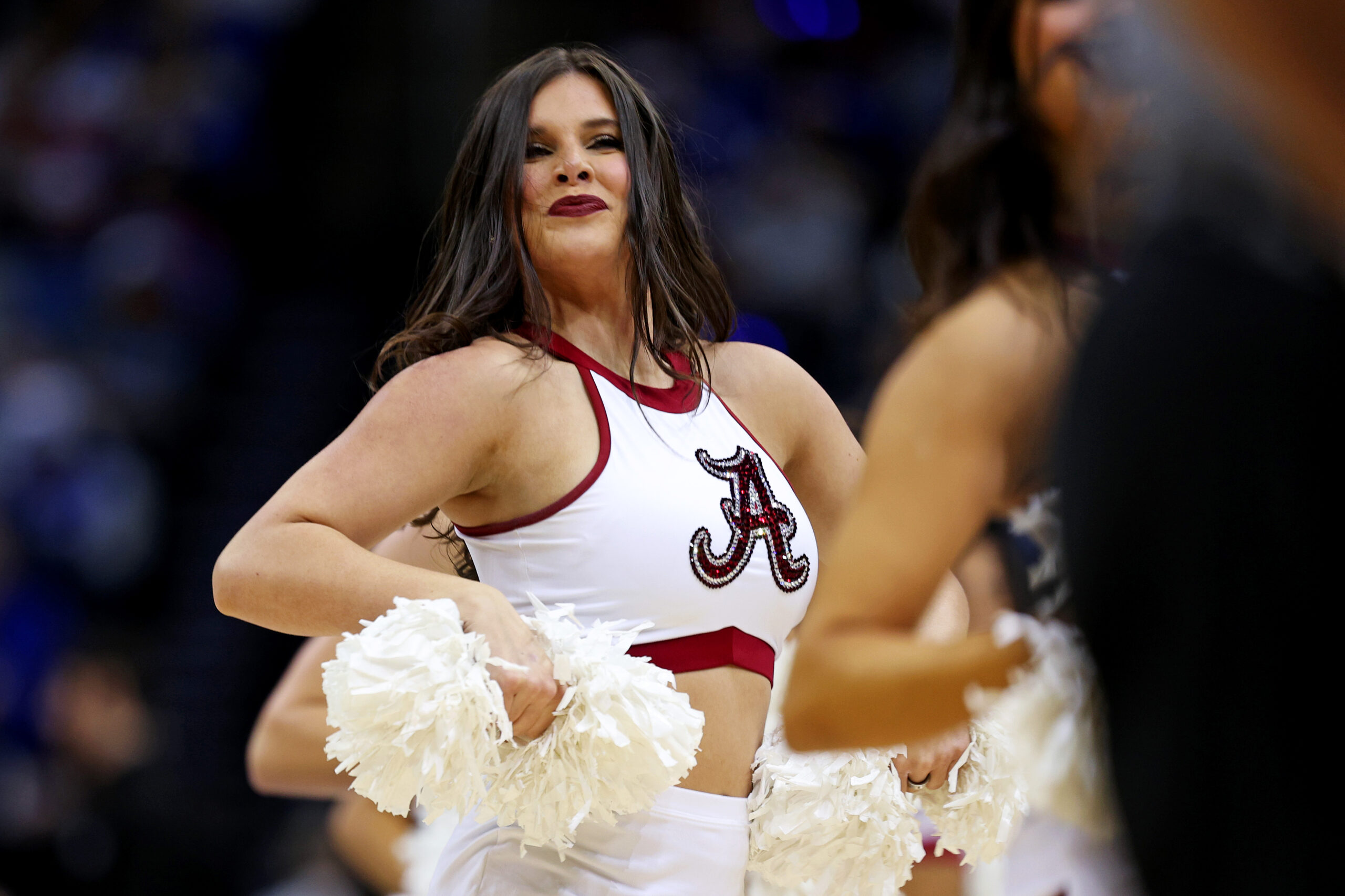 Mar 29, 2025; Newark, NJ, USA; An Alabama Crimson Tide cheerleader during the first half of the East Regional final of the 2025 NCAA tournament between the Duke Blue Devils and the Alabama Crimson Tide at Prudential Center. Mandatory Credit: Vincent Carchietta-Imagn Images