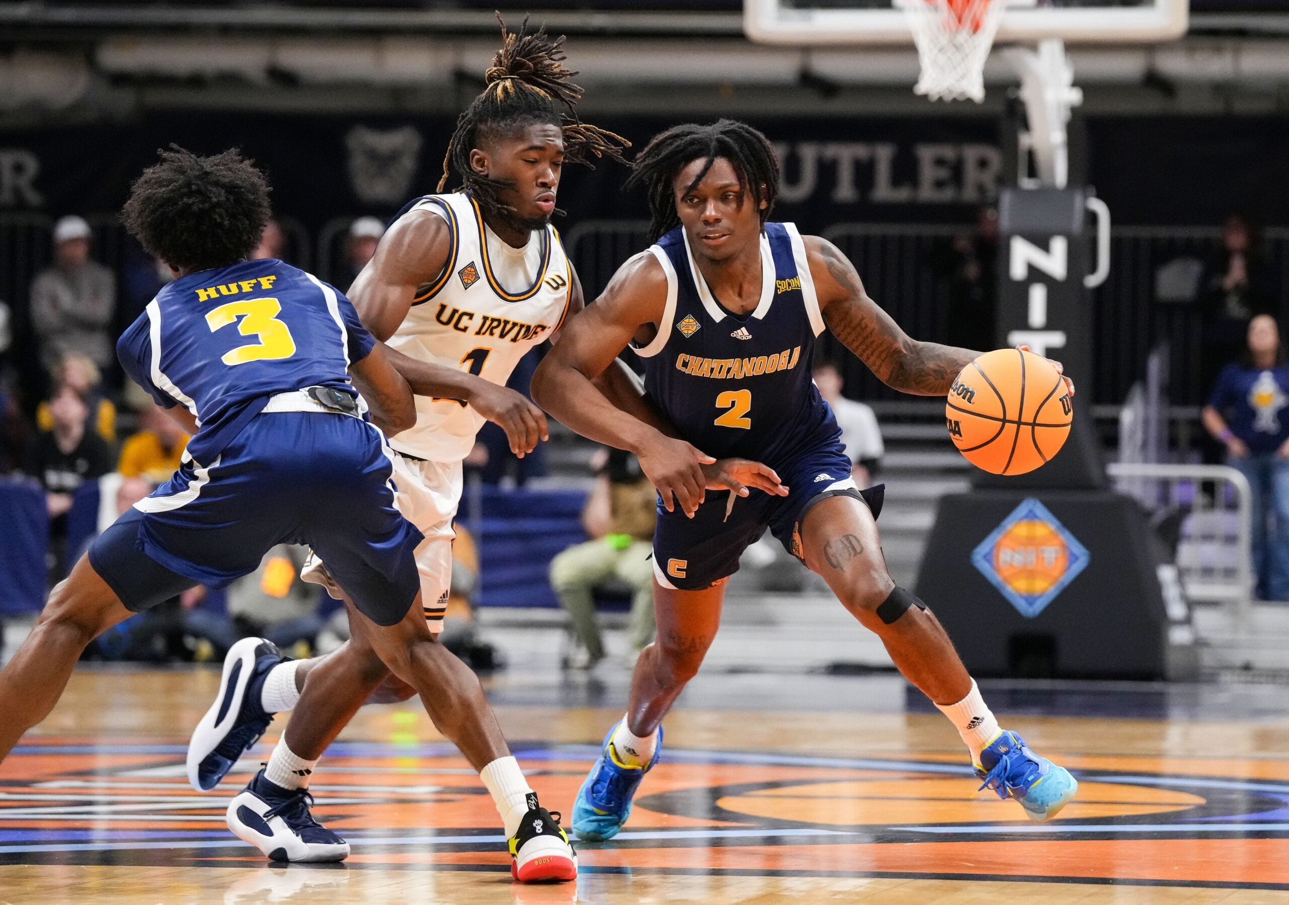 Chattanooga Mocs guard Trey Bonham (2) rushes up the court Thursday, April 3, 2025, during the National Invitational Tournament at Hinkle Fieldhouse in Indianapolis.