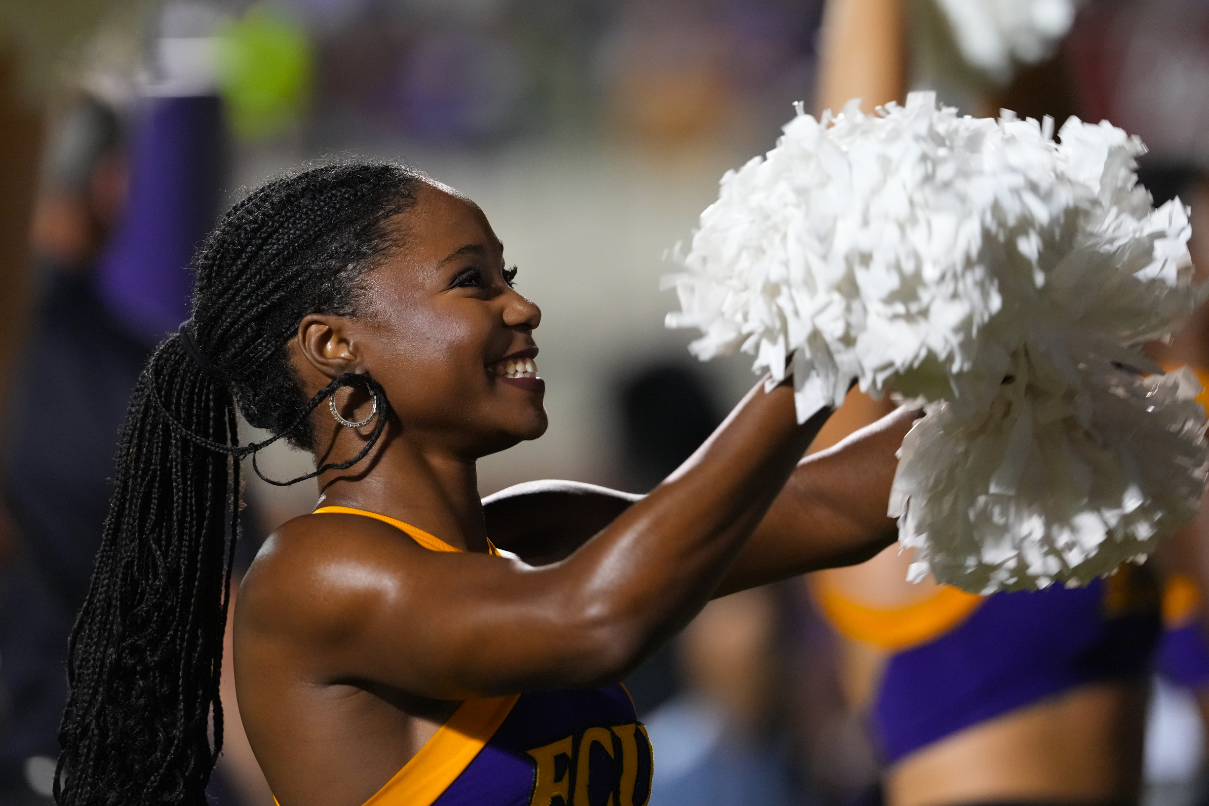 Sep 25, 2025; Greenville, North Carolina, USA;  East Carolina Pirates cheerleader smiles against the Army Black Knights during the first half at Dowdy-Ficklen Stadium. Mandatory Credit: James Guillory-Imagn Images