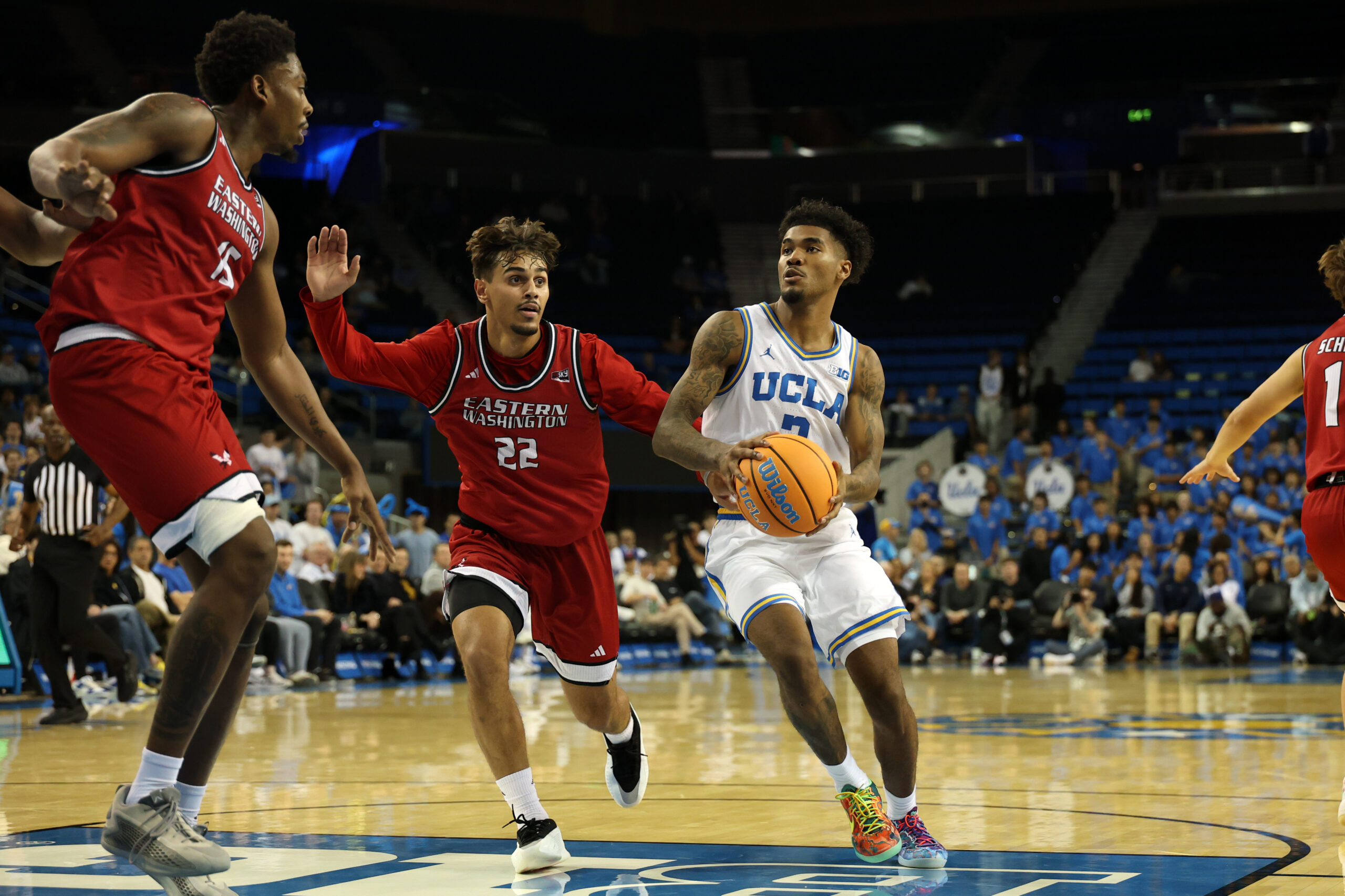 Nov 3, 2025; Los Angeles, California, USA;  UCLA Bruins guard Donovan Dent (2) drives to the basket against Eastern Washington Eagles guard Jojo Anderson (22) during the second half at Pauley Pavilion presented by Wescom Financial. Mandatory Credit: Kiyoshi Mio-Imagn Images