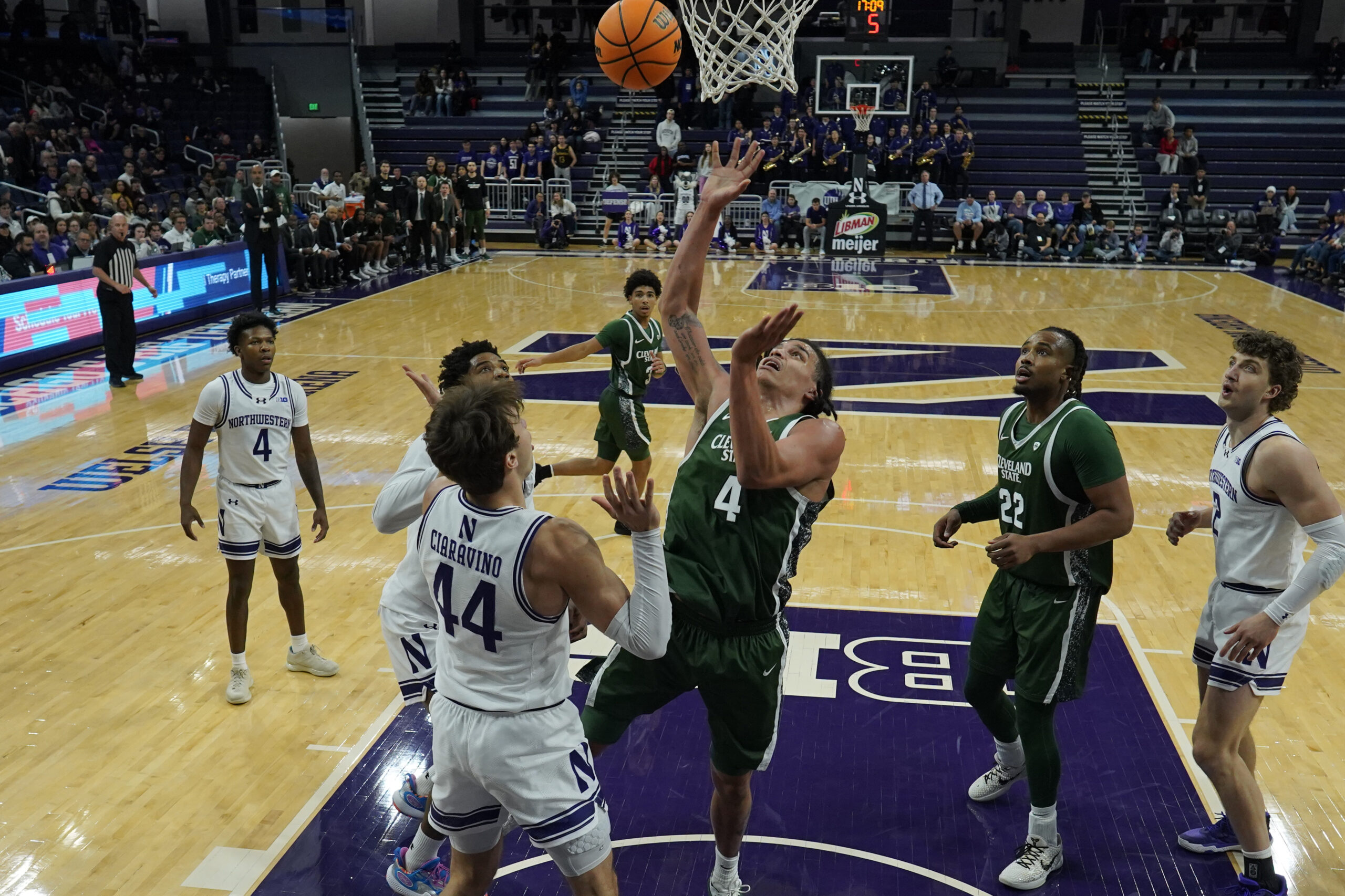 Nov 10, 2025; Evanston, Illinois, USA; Northwestern Wildcats guard Angelo Ciaravino (44) defends Cleveland State Vikings forward Preist Ryan (4) during the first half at Welsh-Ryan Arena. Mandatory Credit: David Banks-Imagn Images