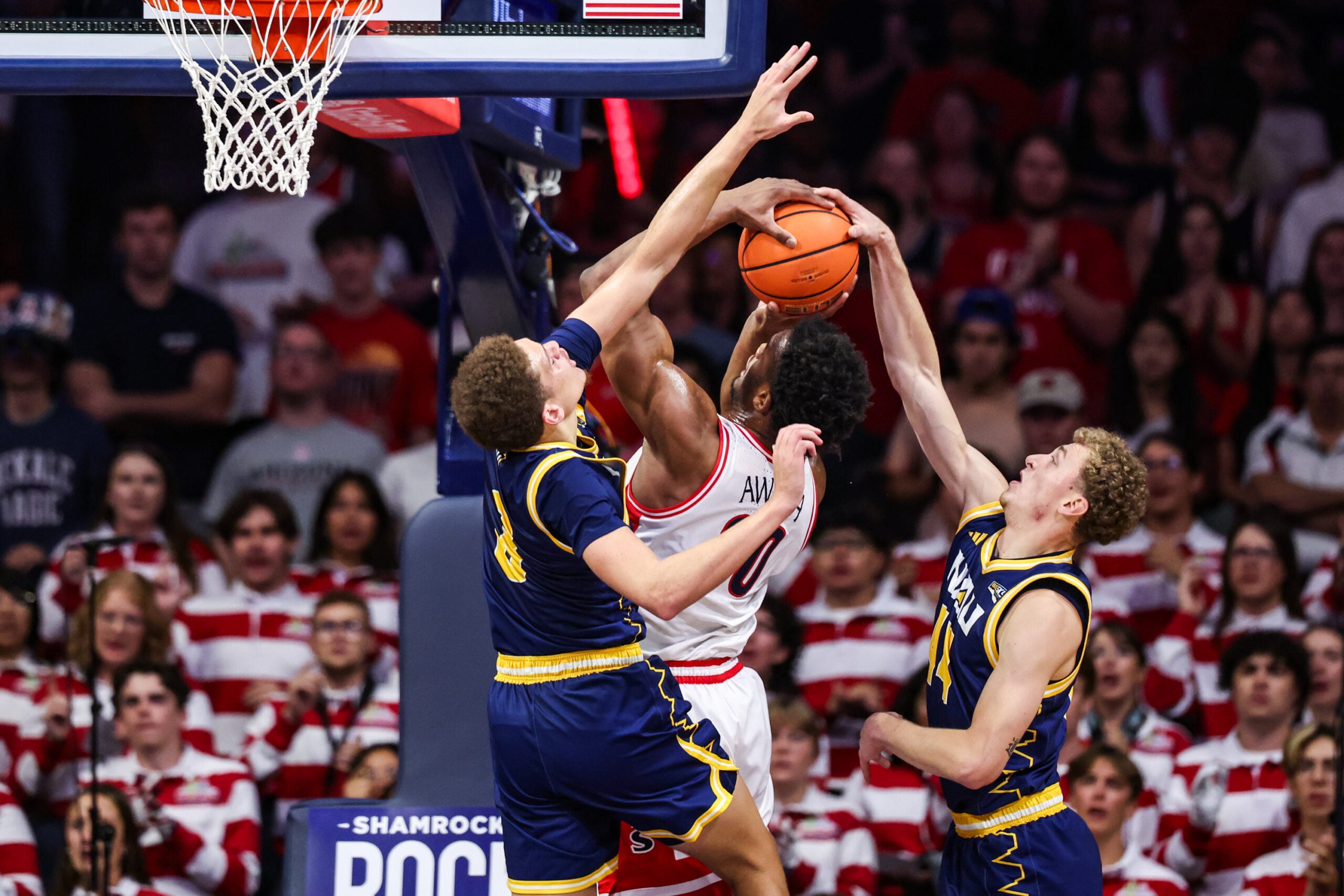 Nov 11, 2025; Tucson, Arizona, USA; Arizona Wildcats forward Tobe Awaka (30) makes a basket while the Northern Arizona Lumberjacks fails to block him during the first half of the game at McKale Memorial Center. Mandatory Credit: Aryanna Frank-Imagn Images