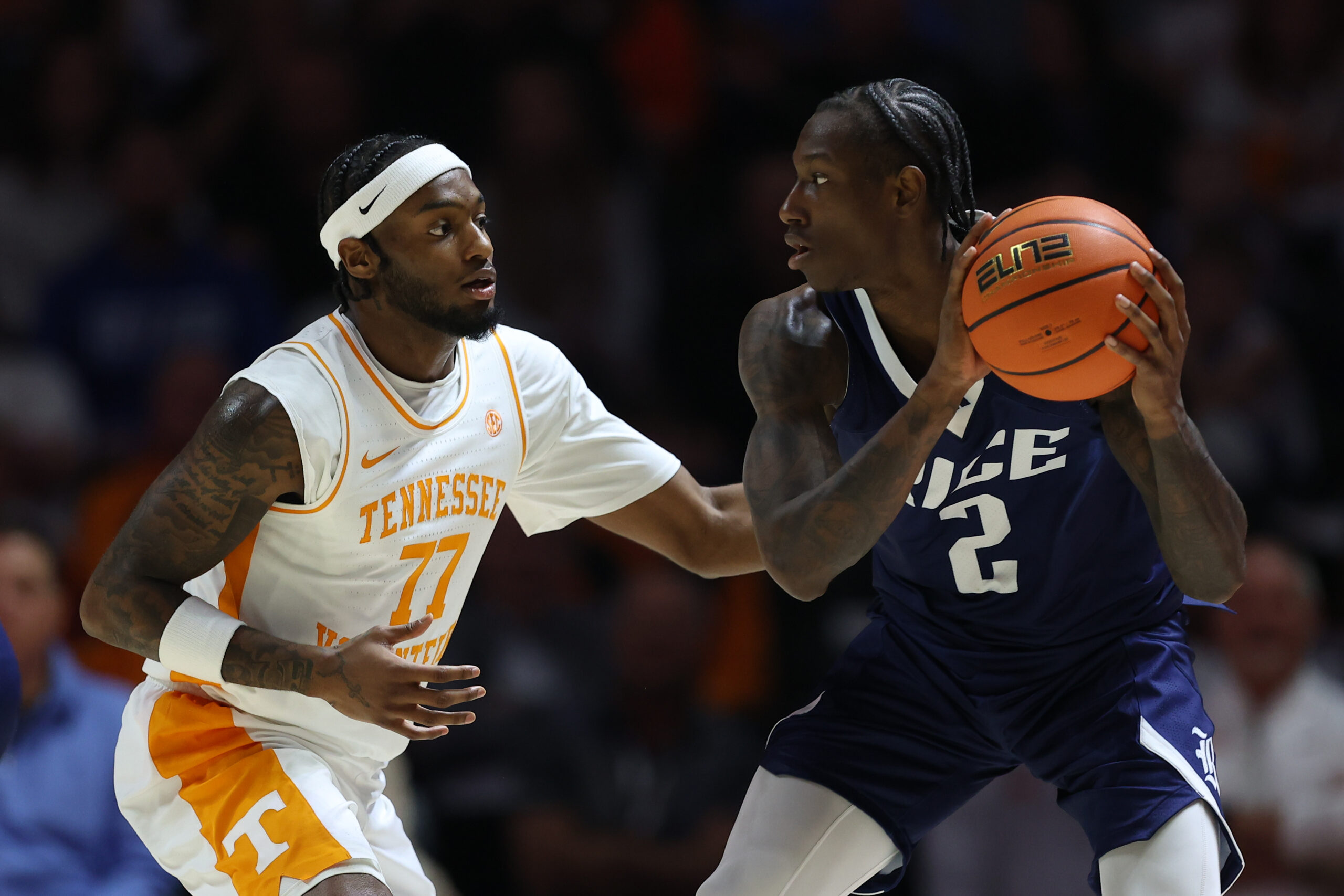 Nov 17, 2025; Knoxville, Tennessee, USA;  Tennessee Volunteers guard Amaree Abram (77) defends Rice Owls guard Jalen Smith (2) during the first half at Thompson-Boling Arena at Food City Center. Mandatory Credit: Randy Sartin-Imagn Images