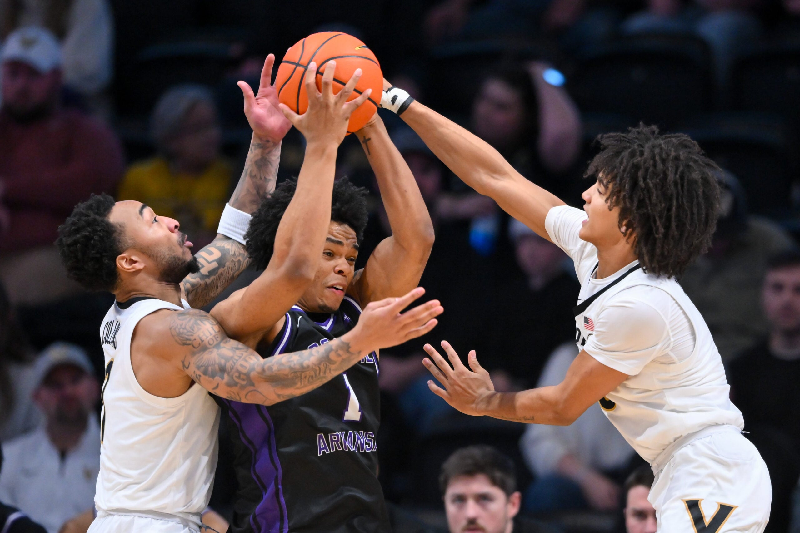 Dec 13, 2025; Nashville, Tennessee, USA; Vanderbilt Commodores guard Frankie Collins (1) and guard Tyler Tanner (3) trap Central Arkansas Bears guard Camren Hunter (1) during the second half at Memorial Gymnasium. Mandatory Credit: Steve Roberts-Imagn Images