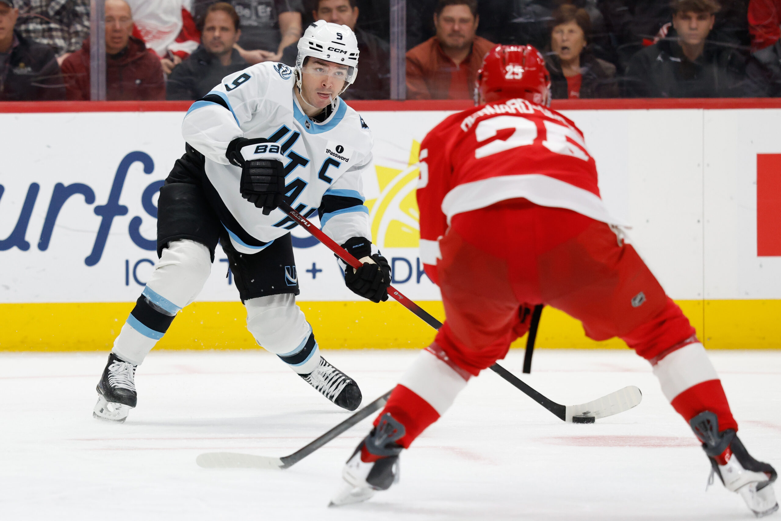 Dec 17, 2025; Detroit, Michigan, USA;  Utah Mammoth right wing Clayton Keller (9) skates with the puck defended by Detroit Red Wings defenseman Jacob Bernard-Docker (25) in the third period at Little Caesars Arena. Mandatory Credit: Rick Osentoski-Imagn Images