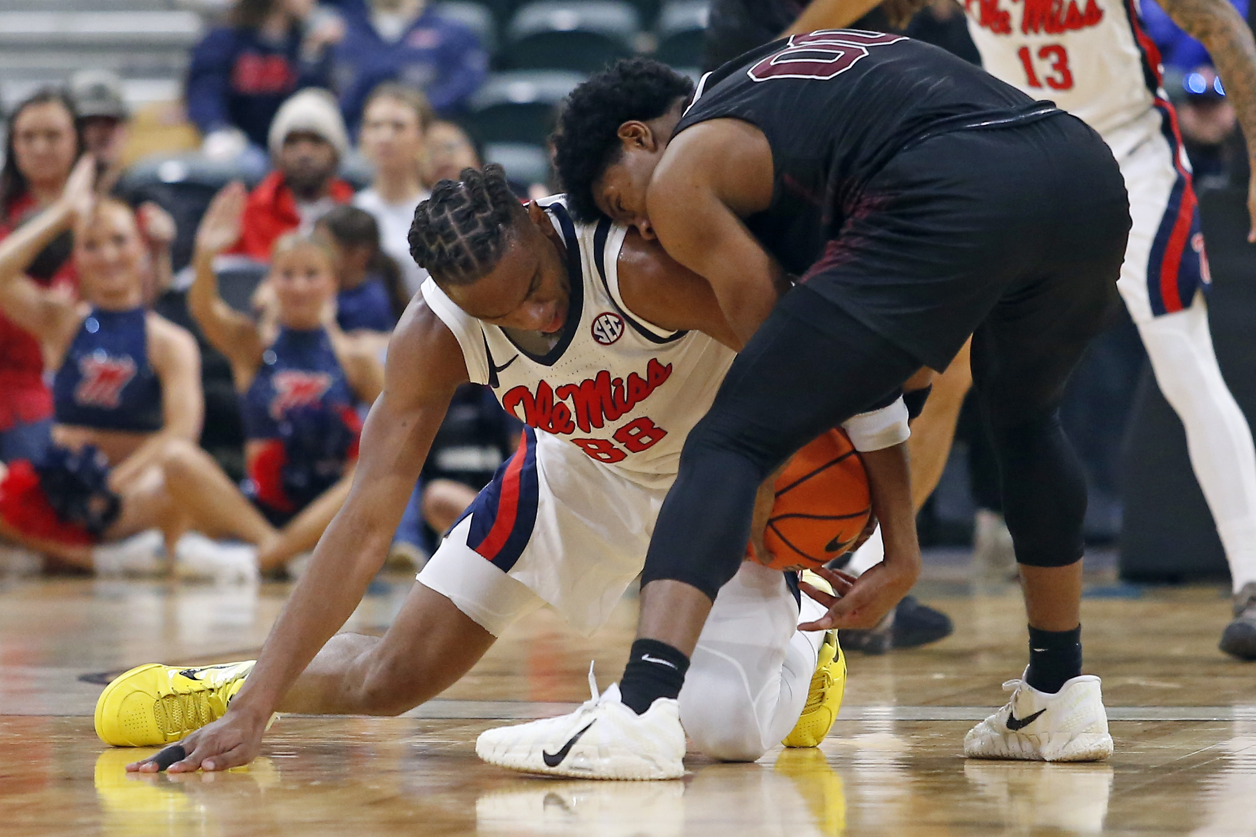 Dec 17, 2025; Tupelo, Mississippi, USA; Mississippi Rebels forward Augusto Cassia (88) and Alabama A&M Bulldogs guard Kintavious Dozier (00) battle for the ball during the second half at Cadence Bank Arena. Mandatory Credit: Petre Thomas-Imagn Images