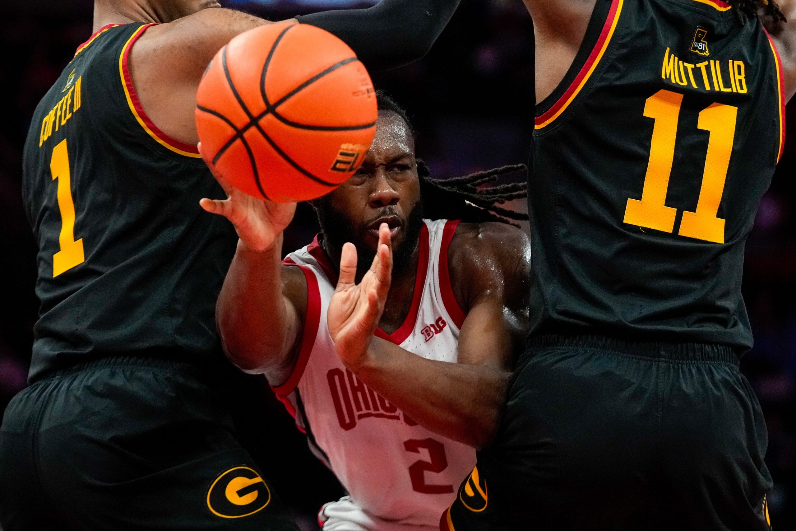 Ohio State Buckeyes guard Bruce Thornton (2) passes the ball against Grambling State Tigers forward Roderick Coffee III (1) and guard Jamil Muttilib (11) in the first half of the NCAA men’s basketball game Value City Arena on Tuesday, Dec. 23, 2025 in Columbus, Ohio.