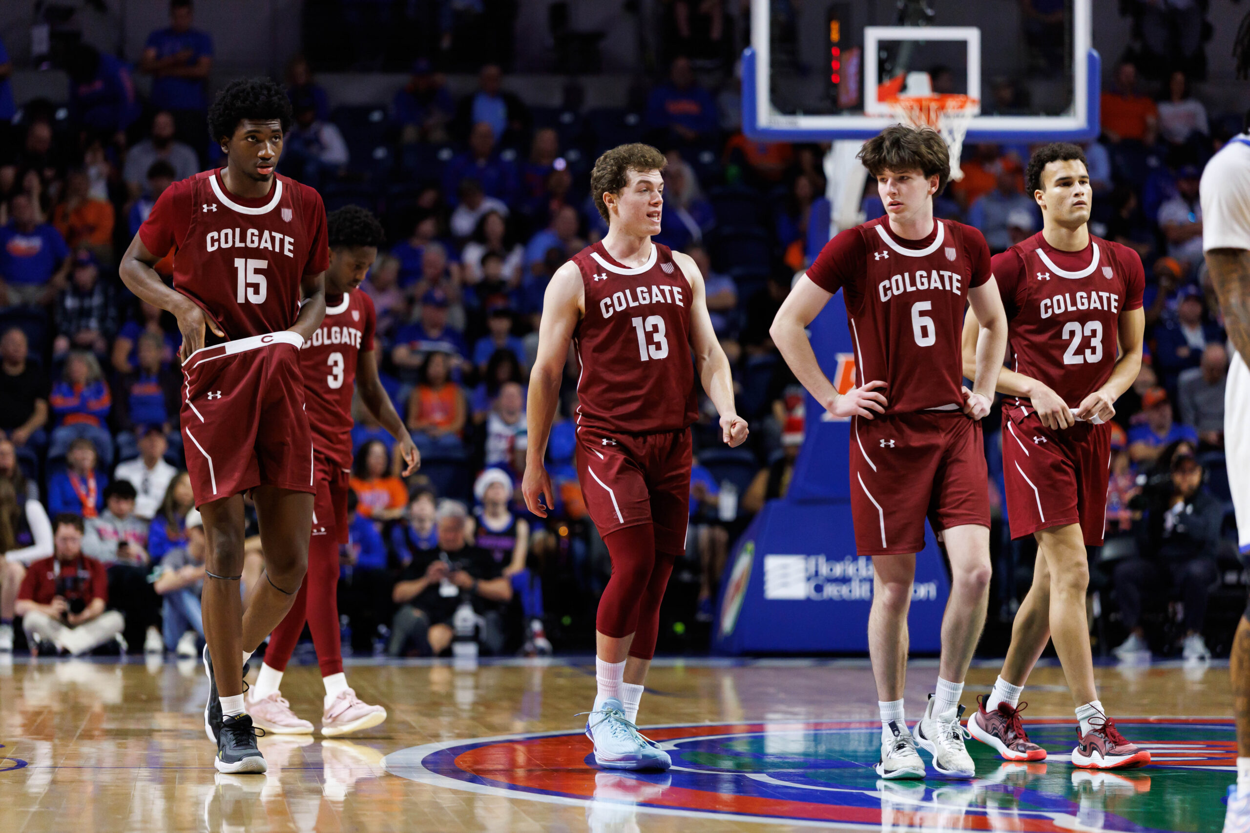 Dec 21, 2025; Gainesville, Florida, USA; Colgate Raiders forward Ayomi Odetoyinbo (15), Colgate Raiders guard Kyle Carlesimo (13), Colgate Raiders guard Ben Tweedy (6) and Colgate Raiders forward Cooper Wright (23) walk on the court against the Florida Gators during the second half at Exactech Arena at the Stephen C. O'Connell Center. Mandatory Credit: Matt Pendleton-Imagn Images
