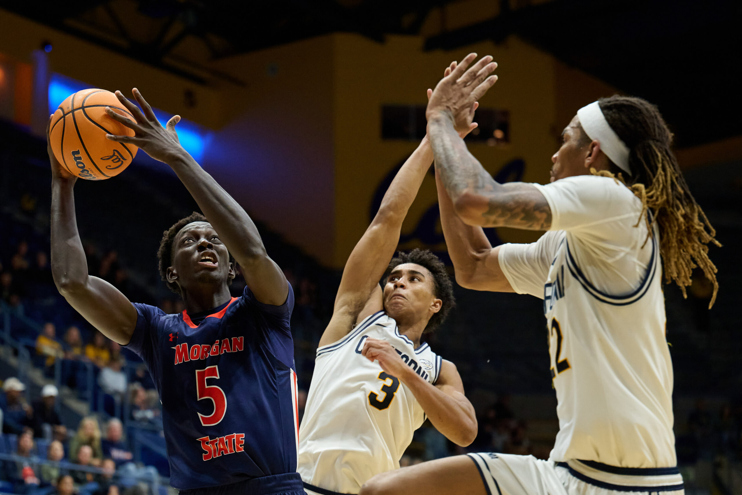 Dec 19, 2025; Berkeley, California, USA; Morgan State Bears forward Matar Wade (5) shoots the ball against California Golden Bears guard Semetri Carr (3) and forward Chris Bell (22) during the second half at Haas Pavilion. Mandatory Credit: Robert Edwards-Imagn Images