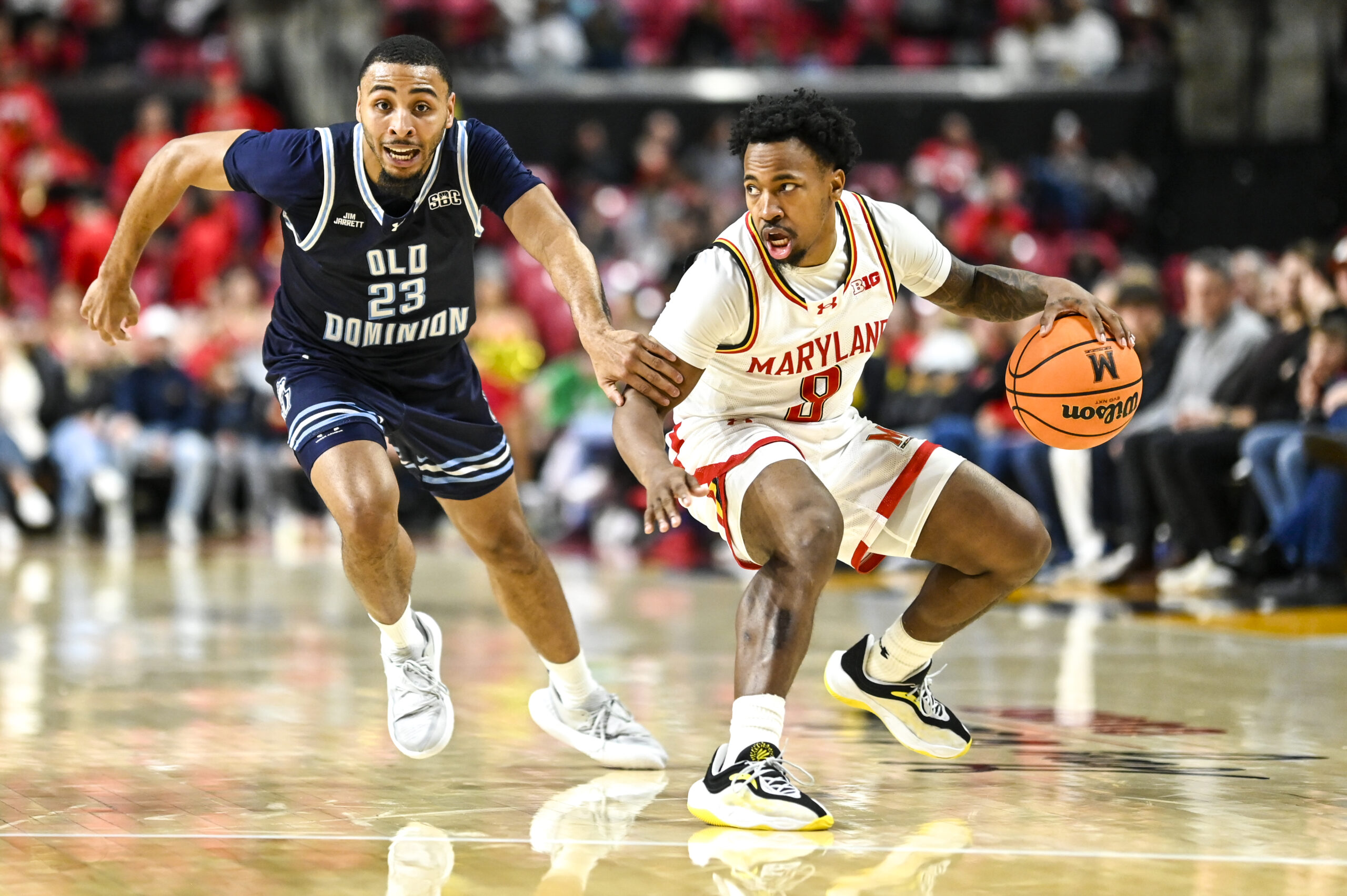 Dec 28, 2025; College Park, Maryland, USA; Maryland Terrapins guard David Coit (8) dribbles as Old Dominion Monarchs guard Jordan Battle (23) defends during the second half at Xfinity Center. Mandatory Credit: Tommy Gilligan-Imagn Images
