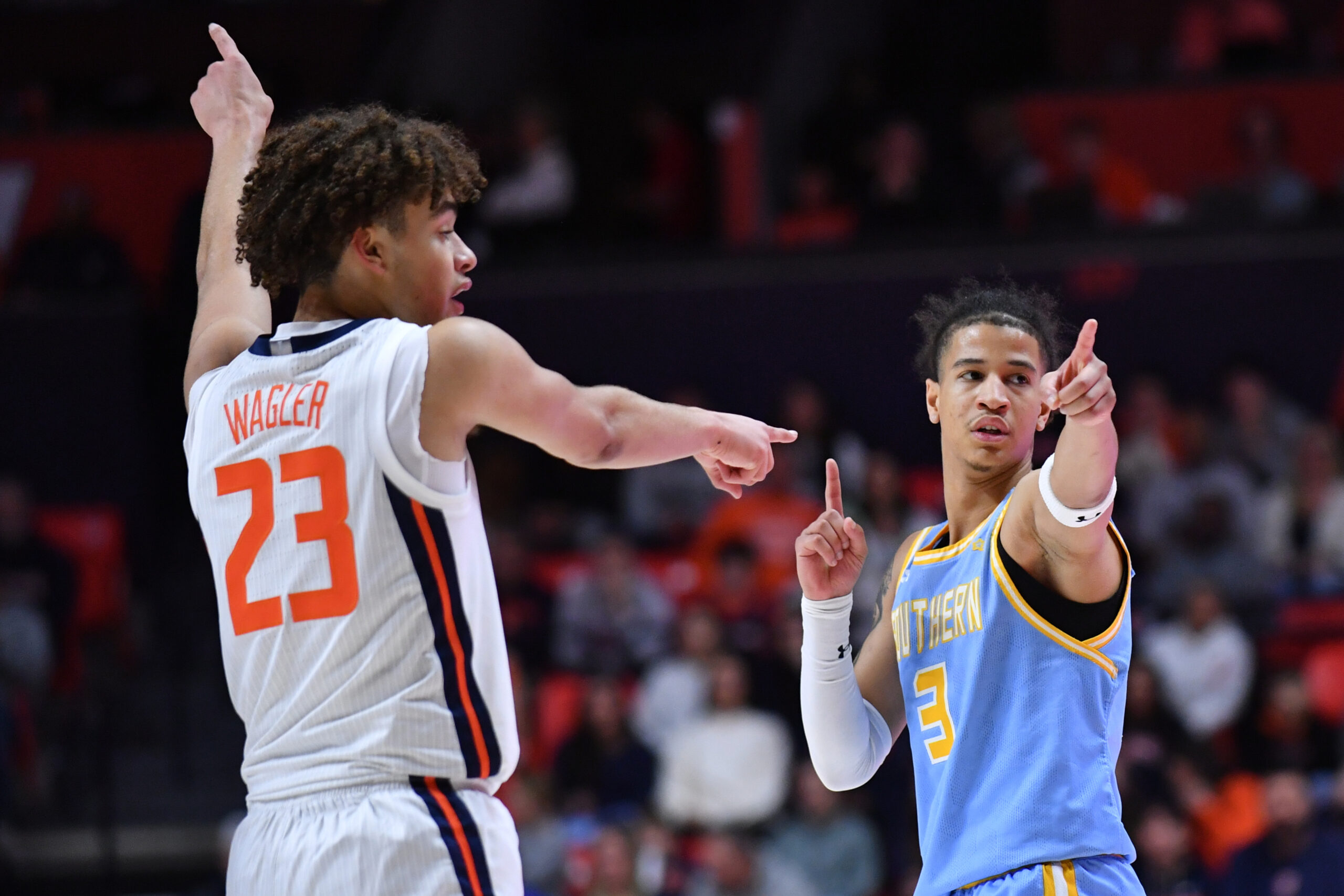 Dec 29, 2025; Champaign, Illinois, USA; Illinois Fighting Illini guard Keaton Wagler (23) and Southern University Jaguars guard Cam Amboree (3) look for a possession call during the second half at State Farm Center. Mandatory Credit: Ron Johnson-Imagn Images