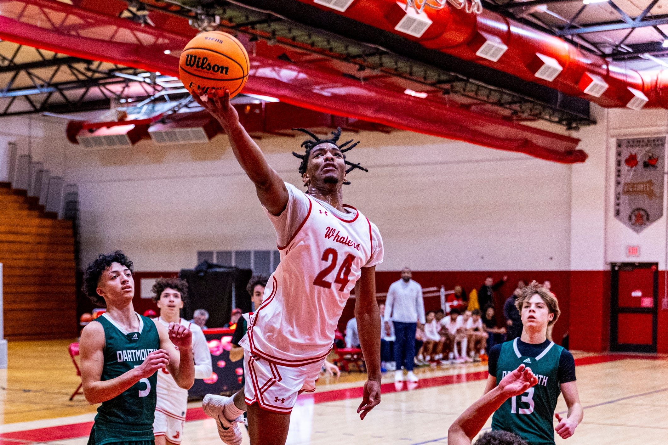 New Bedford's Chris Patterson powers his way to the basket as New Bedford more then double up Dartmouth 89-44 at home on Monday, January 5th.