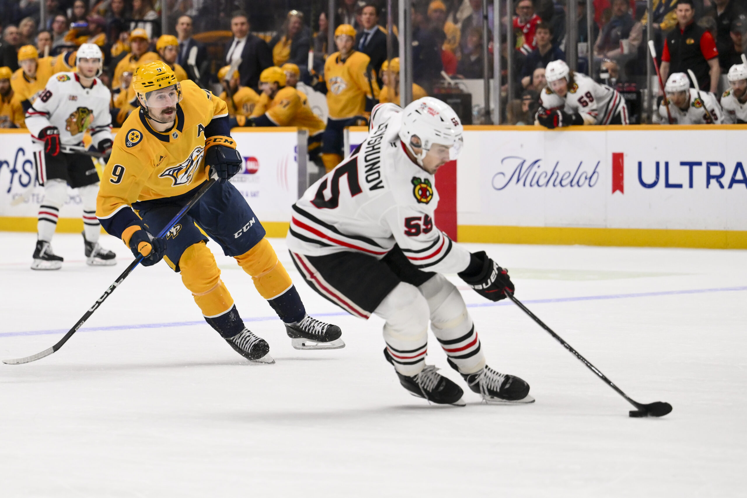 Jan 10, 2026; Nashville, Tennessee, USA;  Chicago Blackhawks left wing Tyler Bertuzzi (59) skates with the puck against the Nashville Predators during the third period at Bridgestone Arena. Mandatory Credit: Steve Roberts-Imagn Images