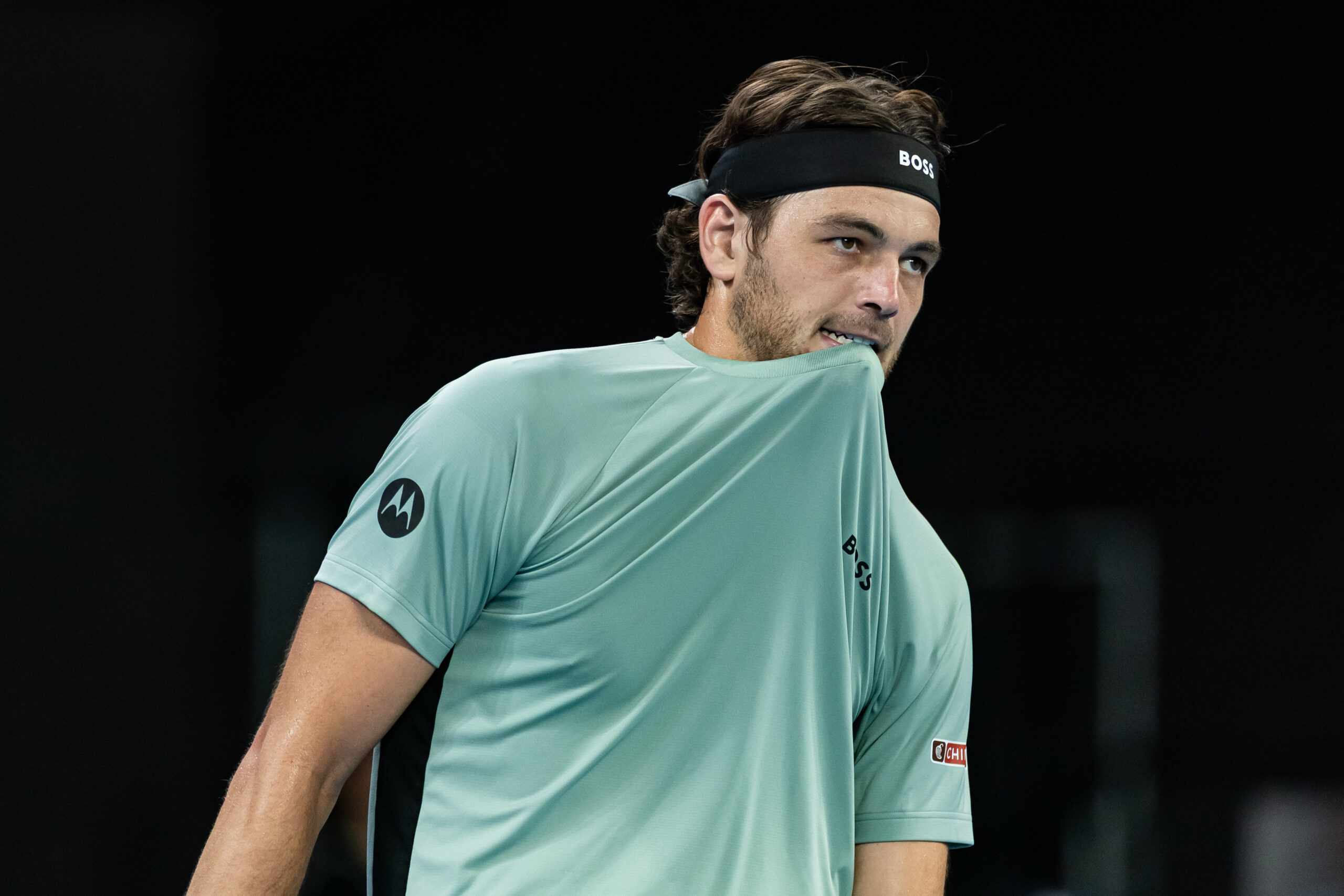 Jan 24, 2026; Melbourne, Victoria, Australia; Taylor Fritz of United States in action against Stan Wawrinka of Switzerland in the third round of the menís singles at the Australian Open at John Cain Arena in Melbourne Park. Mandatory Credit: Mike Frey-Imagn Images