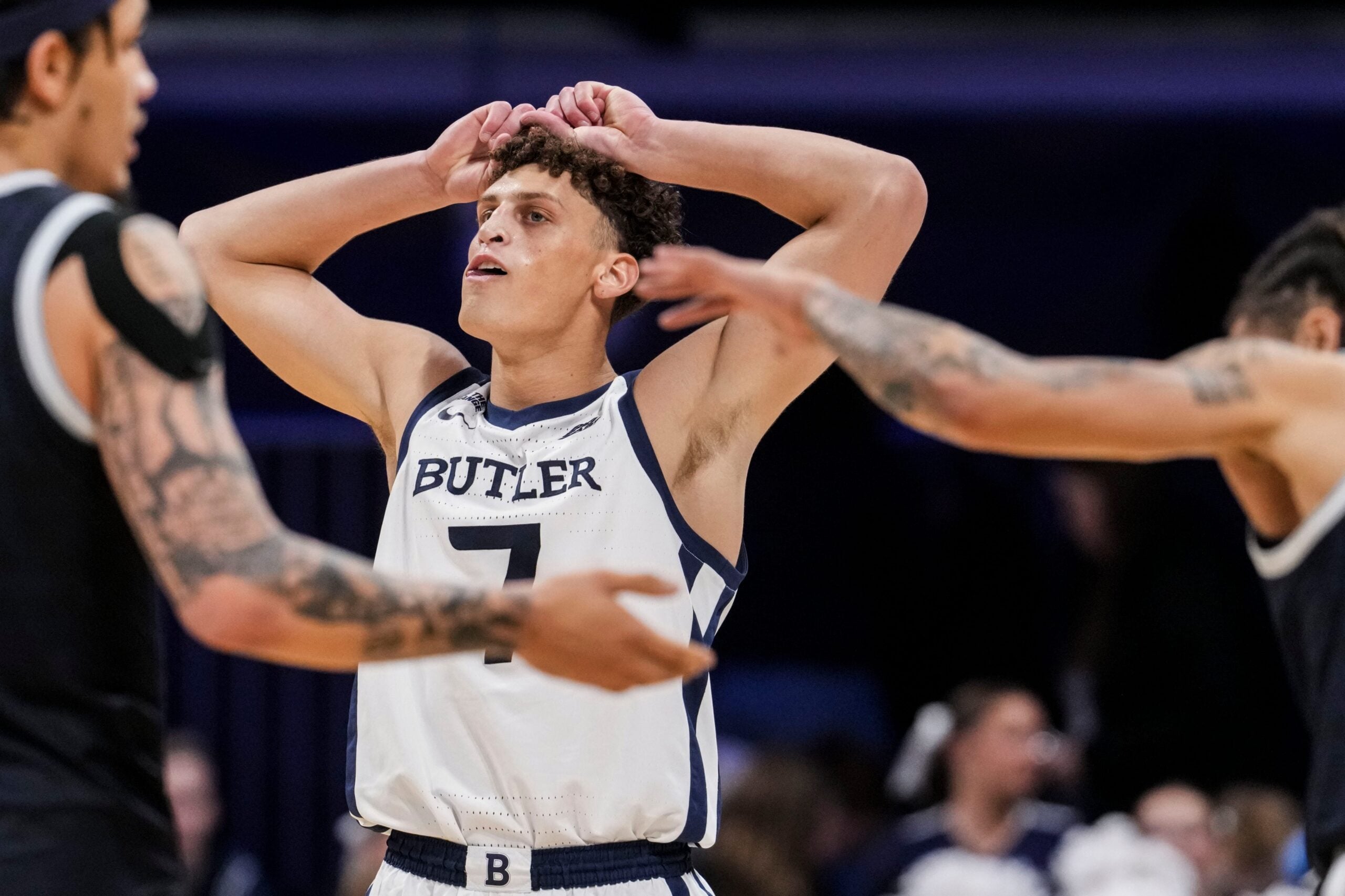 Butler Bulldogs guard Jr. Jamie Kaiser (7) reacts to the loss as Georgetown Hoyas forward Caleb Williams (4) and Georgetown Hoyas guard Malik Mack (2) celebrate Saturday, Jan. 31, 2026, during a basketball game at Hinkle Fieldhouse in Indianapolis. The Georgetown Hoyas defeated the Butler Bulldogs, 77-64.