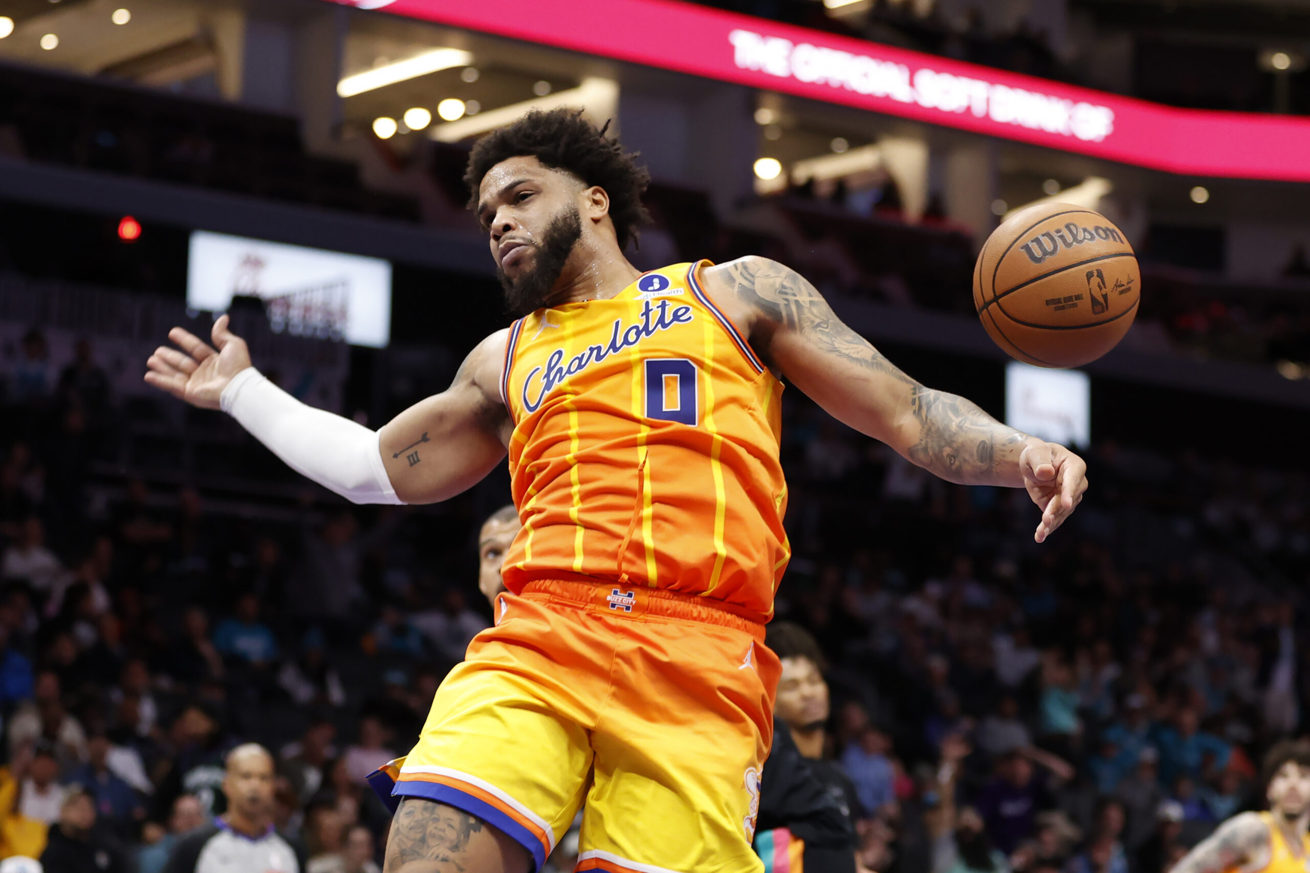 Jan 31, 2026; Charlotte, North Carolina, USA; Charlotte Hornets forward Miles Bridges (0) follows through on a slam dunk against the San Antonio Spurs during second half action at Spectrum Center. Mandatory Credit: Brian Westerholt-Imagn Images