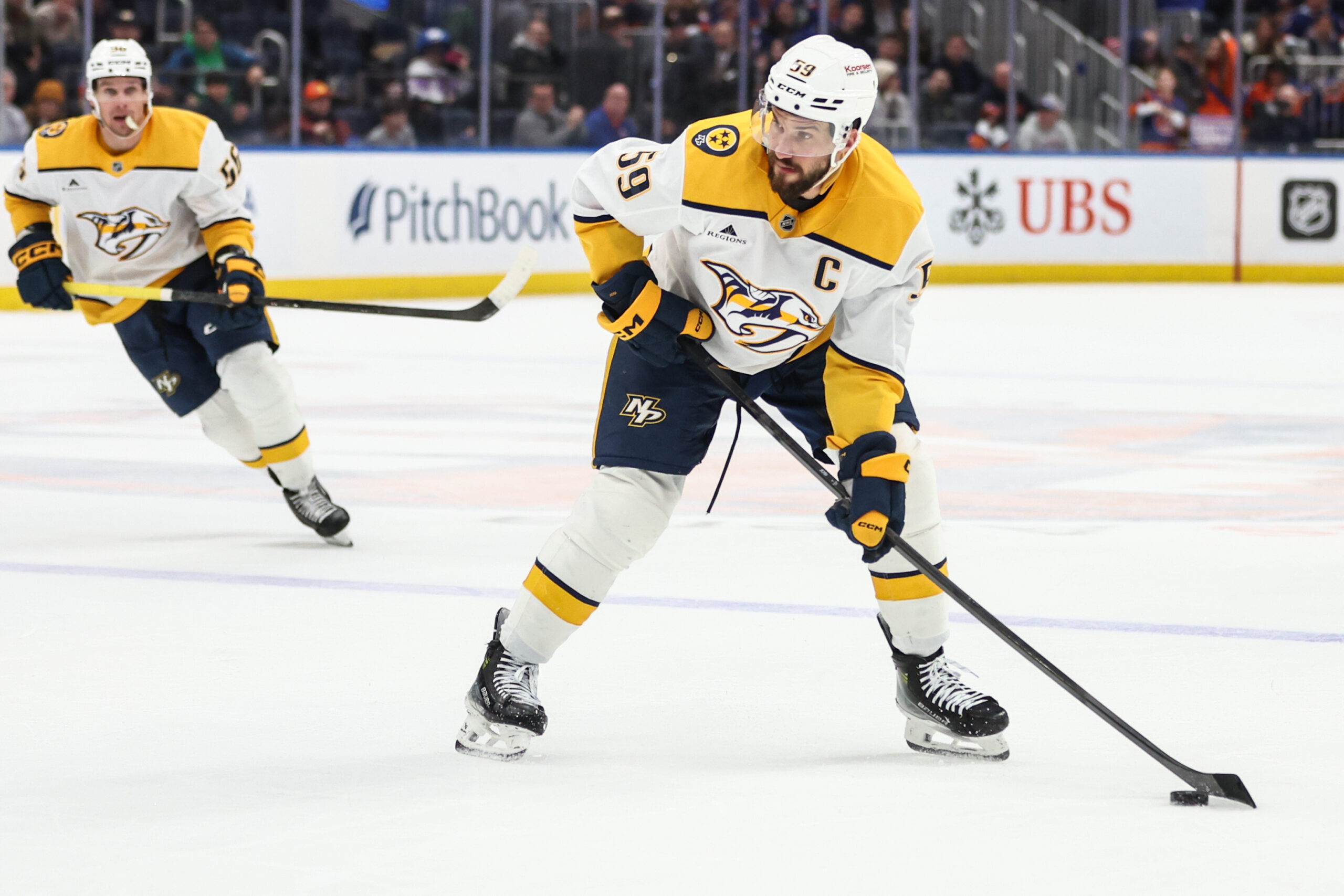 Jan 31, 2026; Elmont, New York, USA;  Nashville Predators defenseman Roman Josi (59) attempts a shot on goal in the third period against the New York Islanders at UBS Arena. Mandatory Credit: Wendell Cruz-Imagn Images